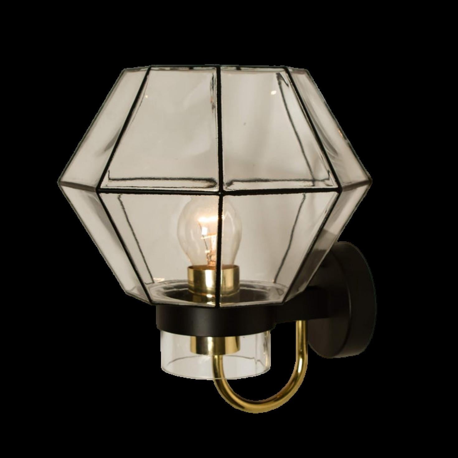 This large set of octagonal glass wall lights were manufactured by Glashütte Limburg in Germany during the 1960s. Minimal geometric design executed with a taste for excellence in craftsmanship. Each lamp, made from elaborate clear glans with