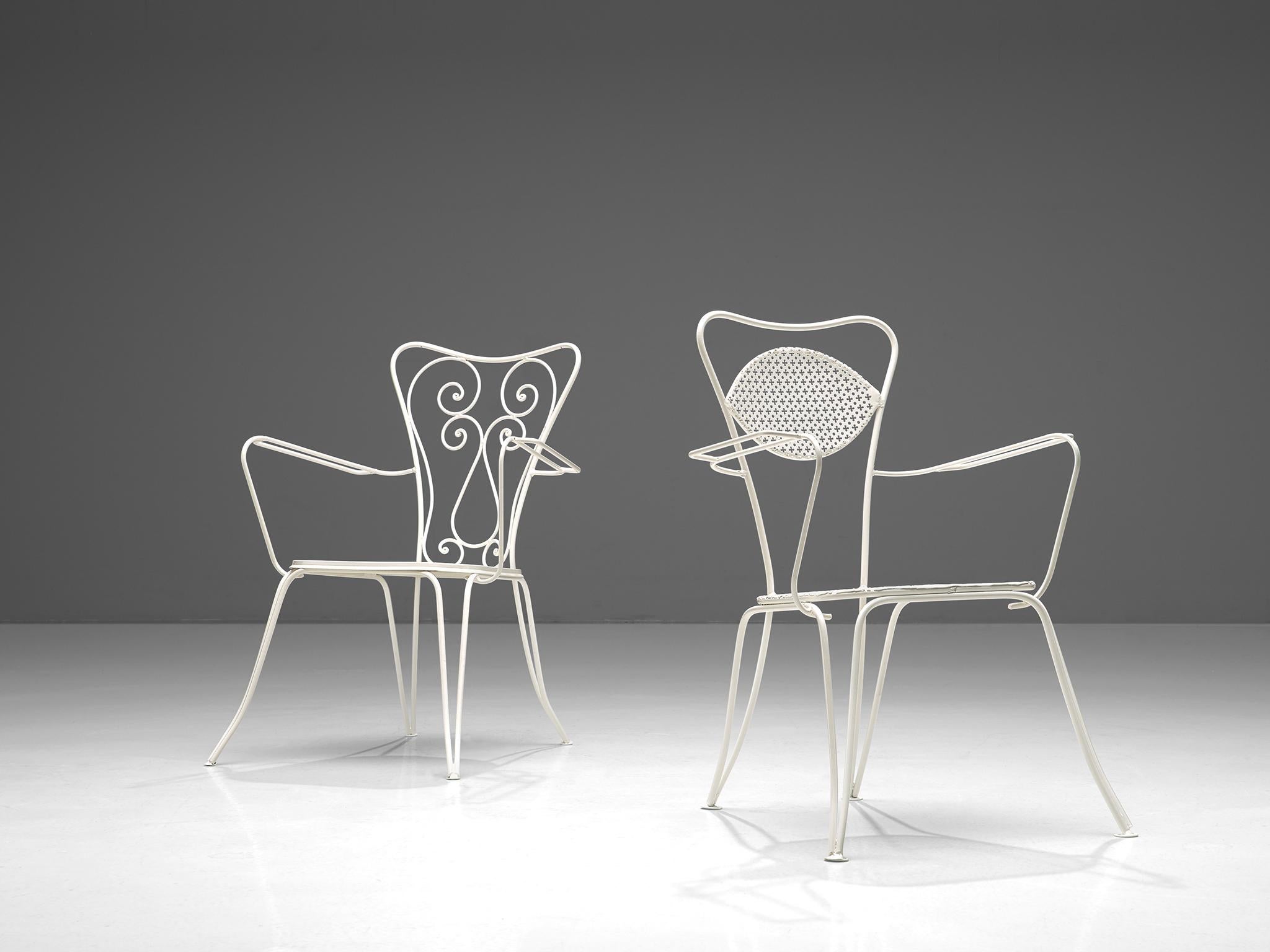 Large set of dining chairs, white recoated metal, Italy, 1960s

Very large set of metal chairs in a white color. The chairs have an elegant, bold design, as is quintessential of Italian patio chairs. Curved shapes and thin armrests form the frame