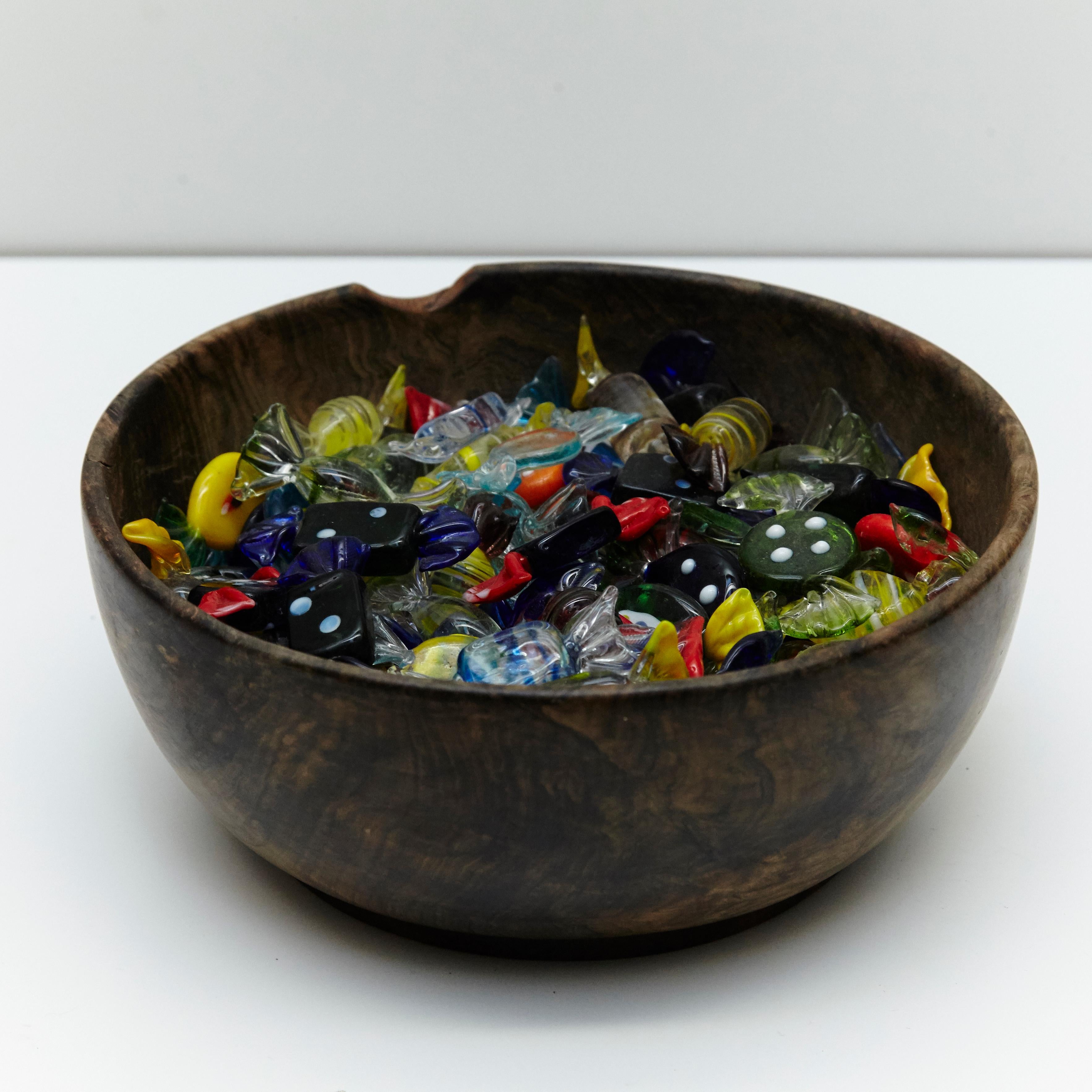 Large set of Murano glass candy small sculptures on olive wood bowl, circa 1970

Manufactured in Italy.

In original condition with minor wear consistent of age and use, preserving a beautiful patina.