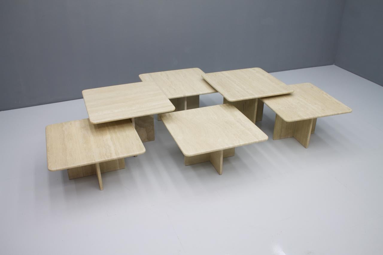 Large set of six Travertine side or coffee tables, Italy, 1970s.

Measures: 2 x W 23.6 x D 23.6 in. x H 15.7 in.
2 x W 23.6 x D 23.6 in. x H 14 in.
2 x W 23.6 x D 23.6 in. x H 12 in.

2 x 60 x 60 x 40 cm
2 x 60 x 60 x 35.5 cm
2 x 60 x 60 x