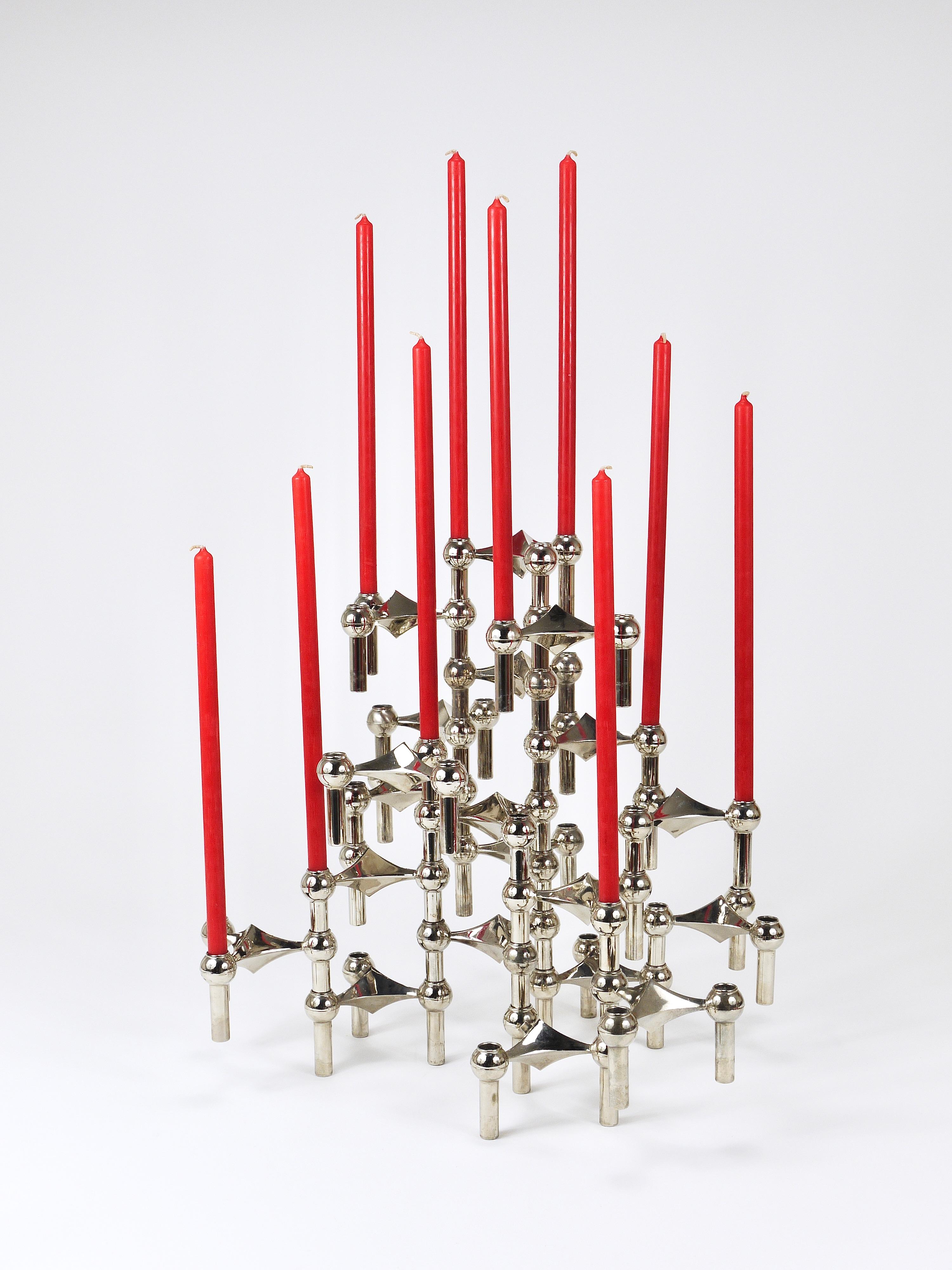 A comprehensive set consisting of 20 Mid-Century Modern stackable tripod candle holders / candle sticks from the 1960s. Designed by Ceasar Stoffi and Fritz Nagel, manufactured by BMF (Bayerische Metallwaren Fabrik), Germany. Made of solid