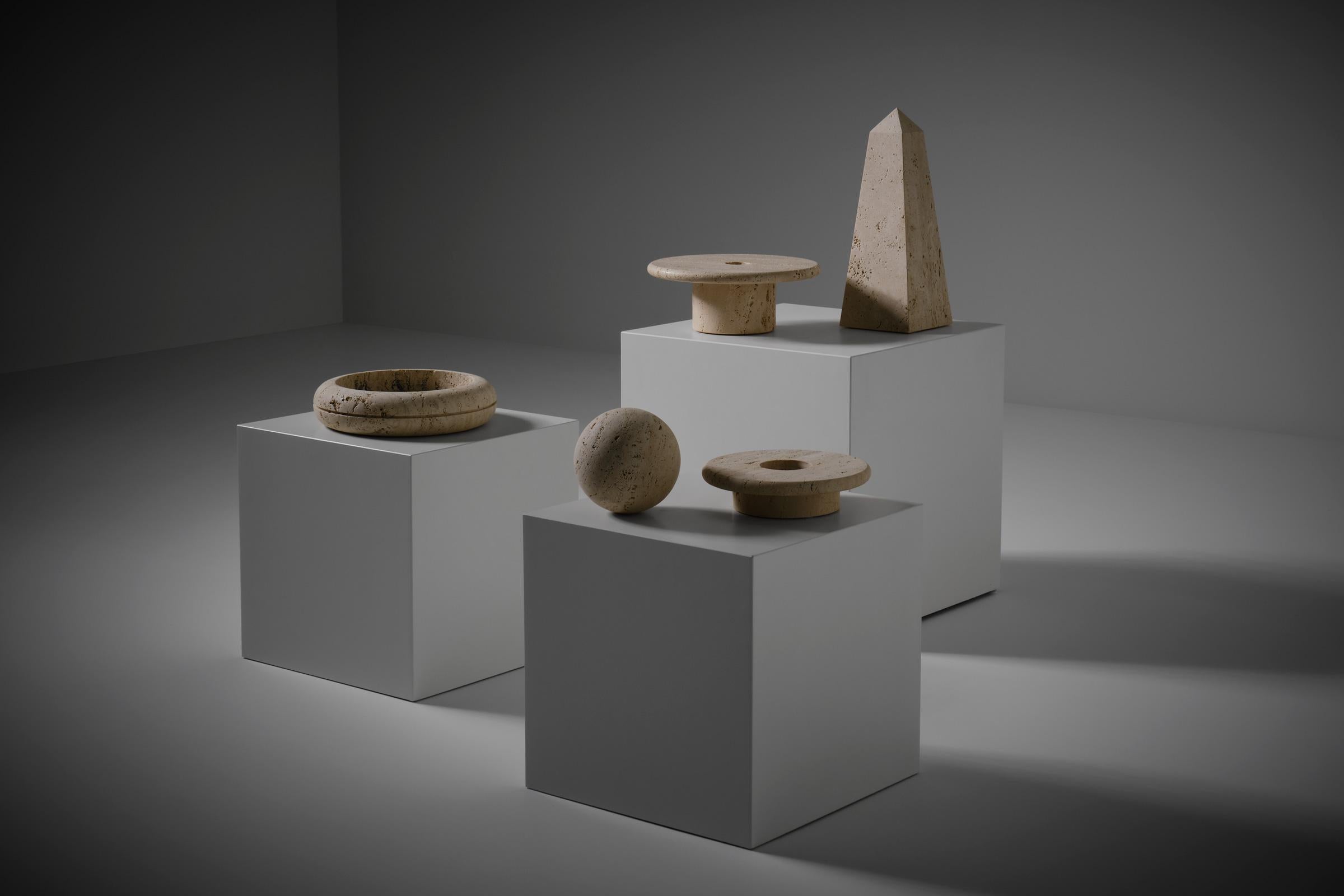 Large set of Travertine objects by Lyda Levi, Italy 1970s. Interesting elementary shapes and objects turned out of solid raw open Travertine. Powerful architectural decoration elements which really strengthen each other by the large group. In very