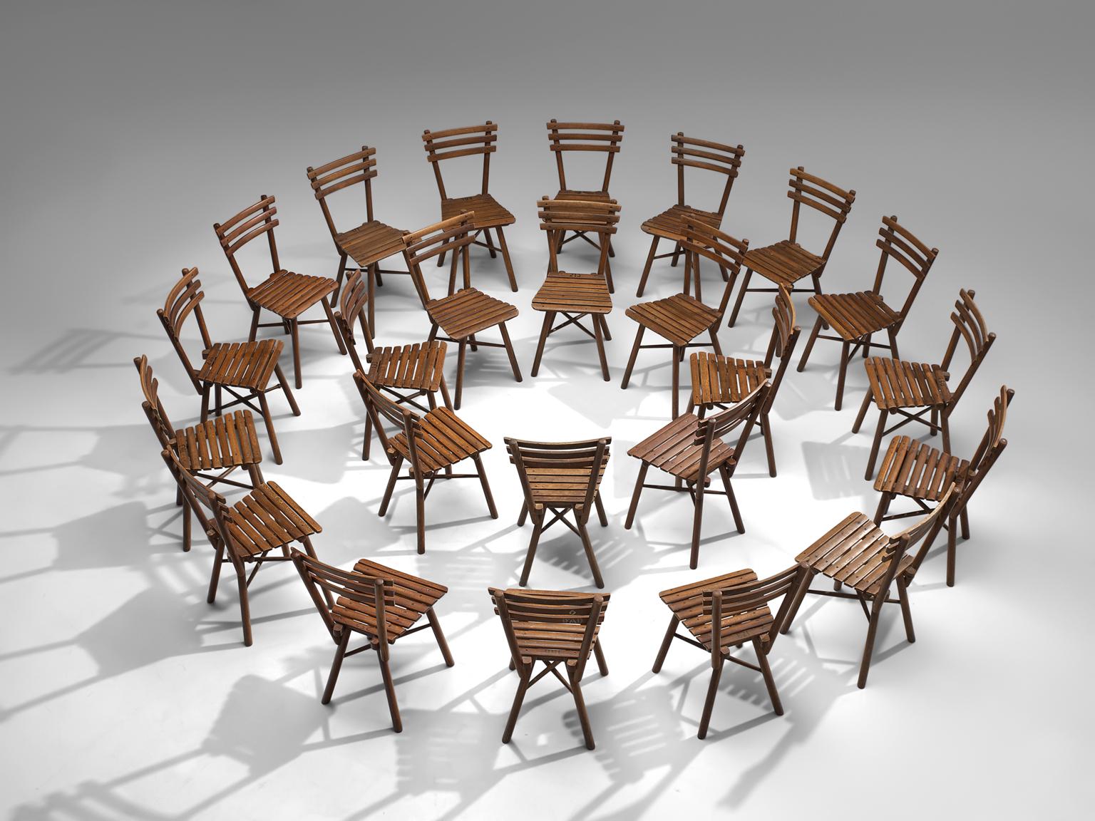 Set of twenty-four Thonet garden chairs in beech by, J. &;J. Kohn 'Nr. 4', circa 1910.

This large set of Thonet chairs are executed by J.&J. Kohn. These chairs have slats as their main feature and their legs are connected with a crossed base.