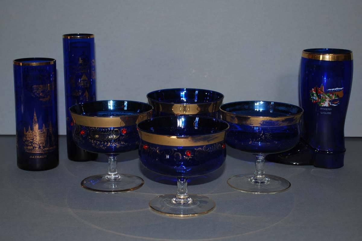The highly decorative collection consists of 69 pieces cobalt blue hand-painted and 22K gold gilded objects.
Among there are goblets, decanters, vases, cordials, perfume bottle atomizer and other items.
The decoration is ornate and elegant and