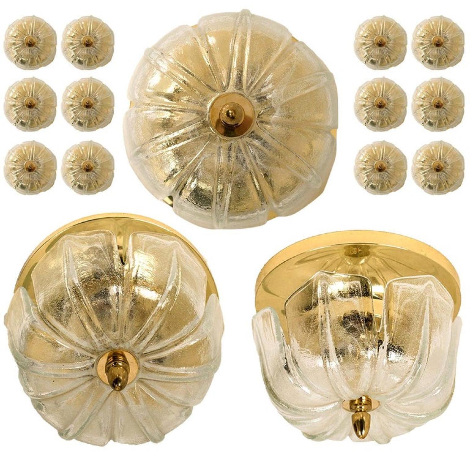 Large set of Limburg glass wall lights/ ceiling lights tulip shaped shade on a brass frame, circa 1970s, Germany.
The handmade high quality shades gives texture which fades towards the edges.

These sculptural wall lights could also be used as