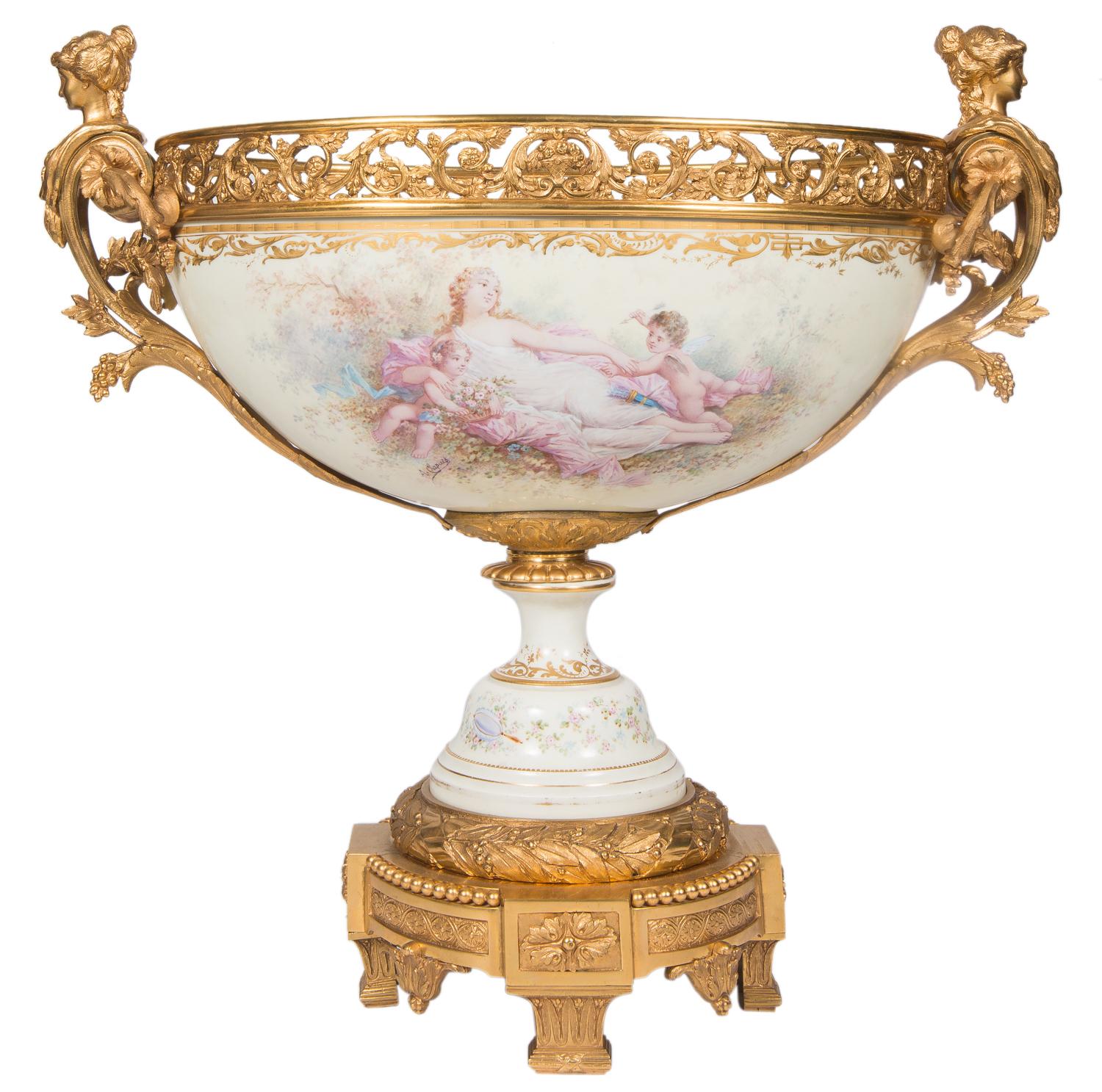 A very impressive, beautifully painted Sevres style porcelain garniture, having a pair of lidded urns on either side of a large comport, with gilded ormolu monopodia handles, the painted scenes depicting classical reclining female figures with
