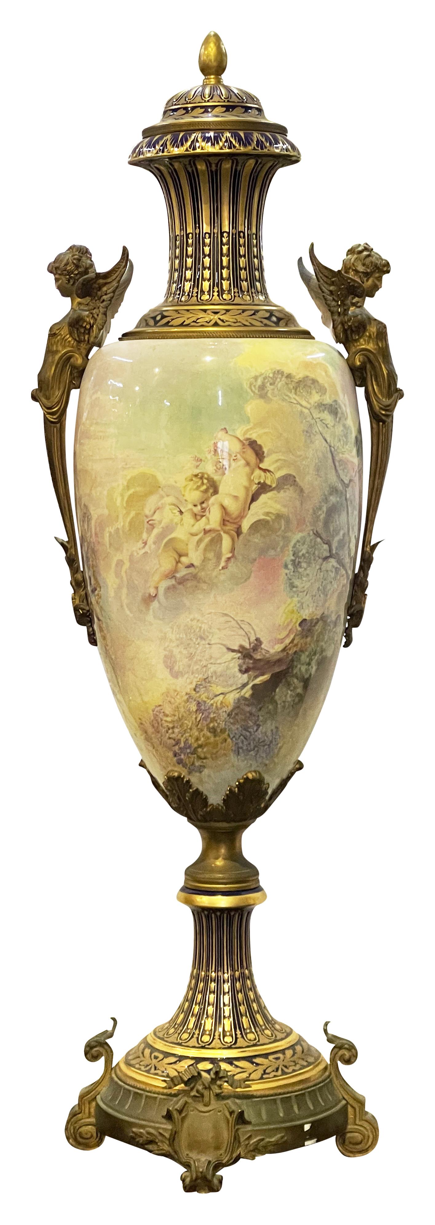A Monumental late 19th Century French Sevres style porcelain lidded vase. Depicting courting lovers in a garden. Having wonderful gilded ormolu mounts and a pair of winged monopodia handles to either side.
Signed; Morant


Batch 82 58131 ASSYN