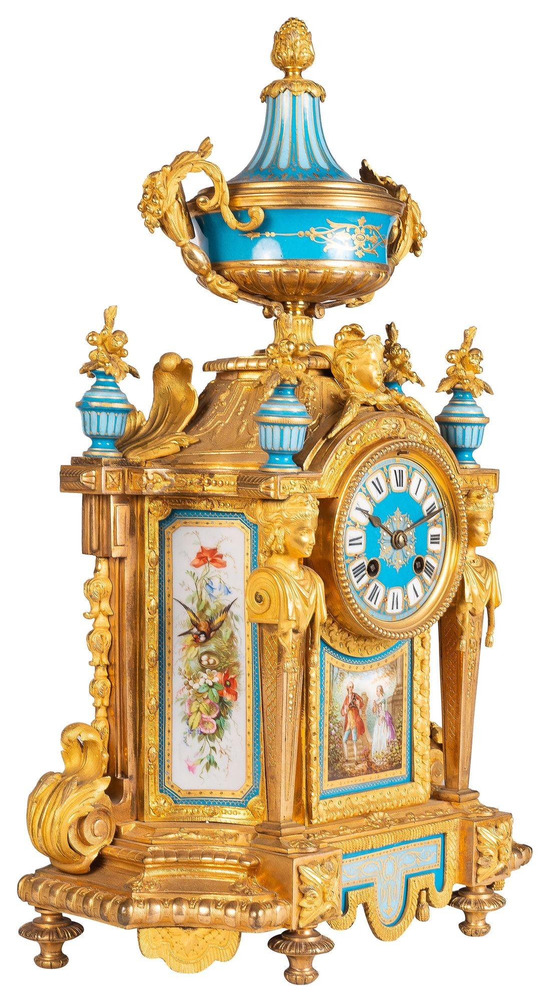 A very impressive 19th Century French Serves style porcelain and gilded ormolu clock garniture. Having Turquoise ground with inset hand painted romantic scenes to the porcelain, ormolu monopodia supports either side of the clock face, an eight day