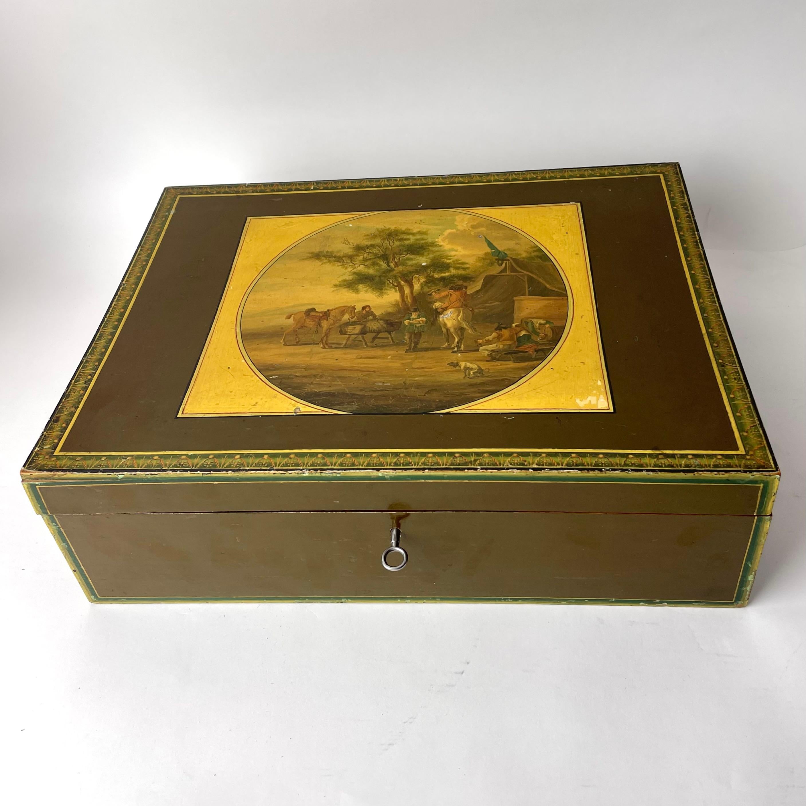 A large and intricately decorated Empire lacquer work sewing box. Early 19th century Europe.

The box is decorated with pastoral scenes and an intricate pattern on the edges. The inside of the box consists of several smaller boxes, also depicting