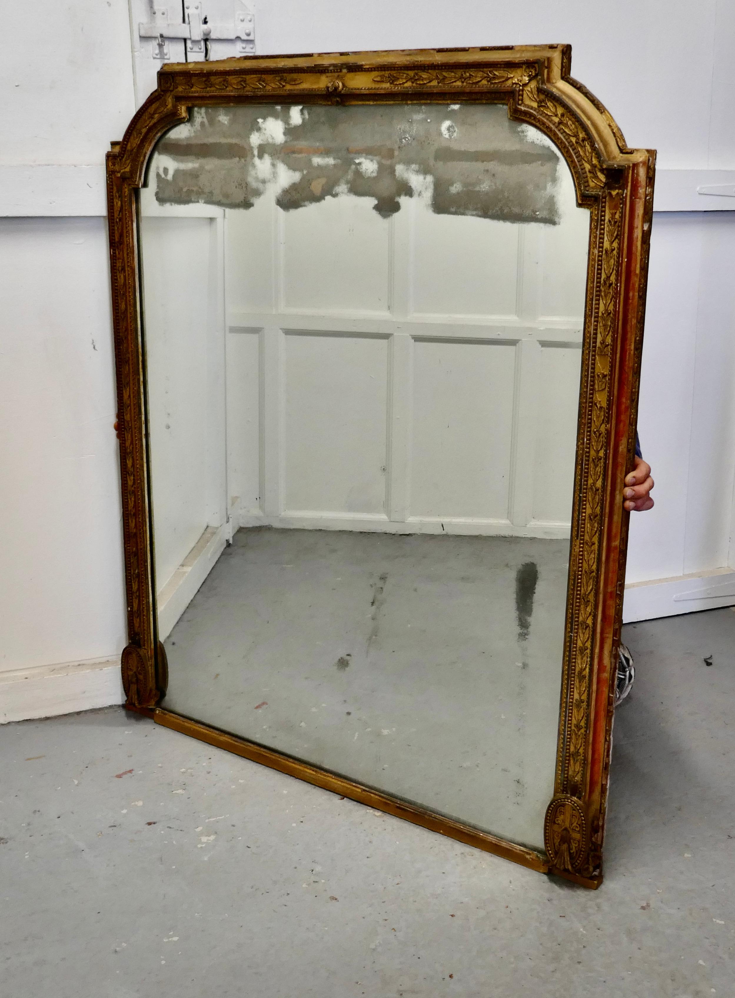 Large shabby gilt overmantel 

The over mantel as it name implies was made to sit over the mantel piece and as so many fireplaces are opposite the window mirrors were used to reflect more light into the room
The old gold frame is 3.5” wide and it