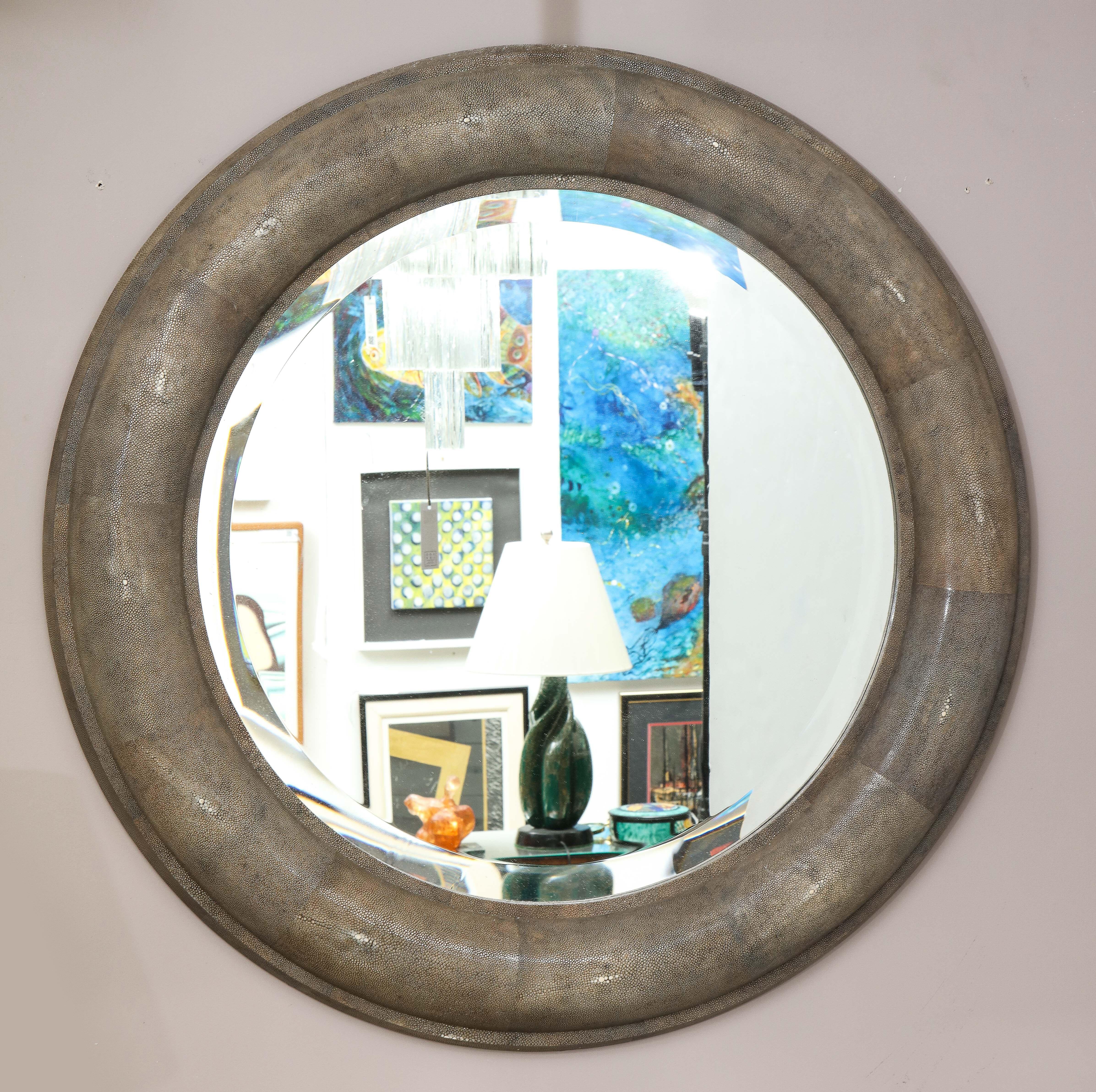 A large Shagreen beveled circular mirror by Karl Springer. A fabulous mirror in a green/grey authenticated by Tom Langevin former director of design Springer LTD. This design is from 1975.