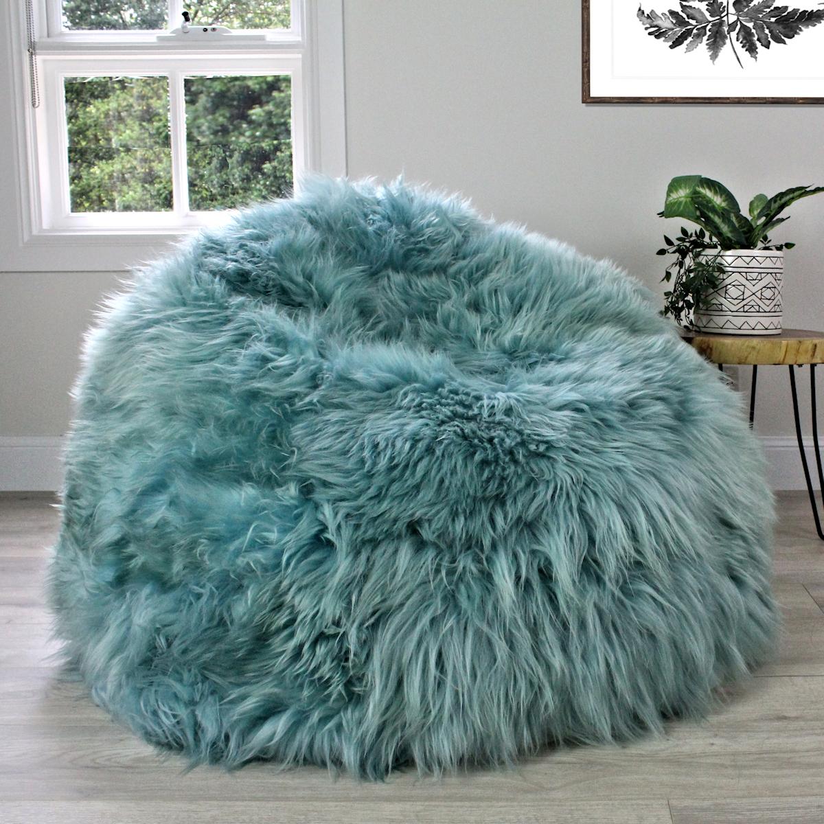 Imagine sitting back and relaxing into this eco-friendly and super lush, aqua sheepskin bean bag. This large and long wool shaggy bean bag chair is handcrafted from the finest and velvety Swedish sheepskin resulting in the most amazing softness and