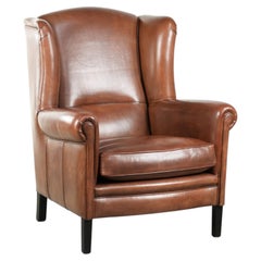 Gran sillón orejero de piel de oveja de estilo inglés atemporal