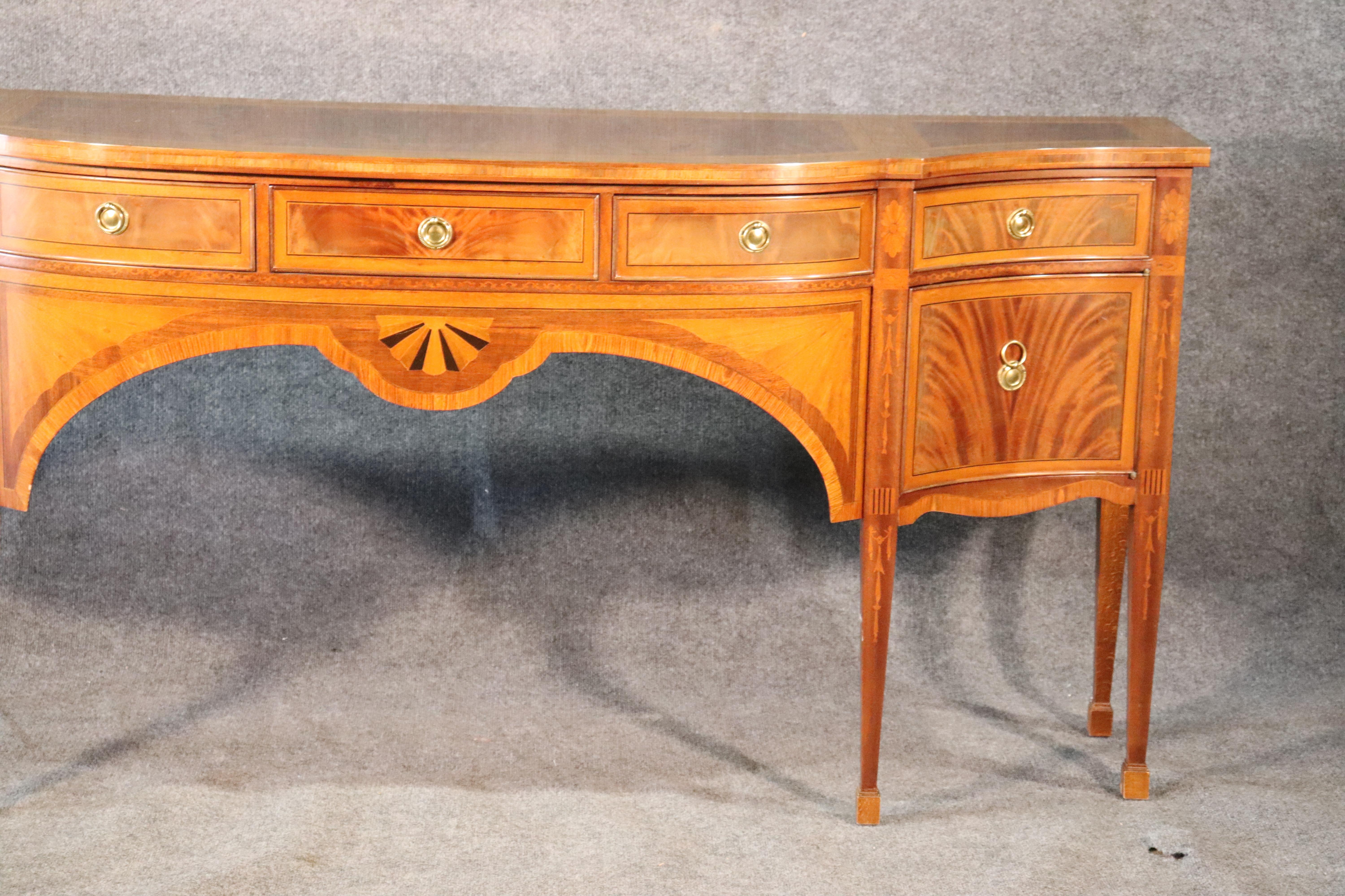 This is a pale and yet beautiful flame mahogany sideboard with great design elements and quality. 
The sideboard measures 78 wide x 21 deep x 36 tall.