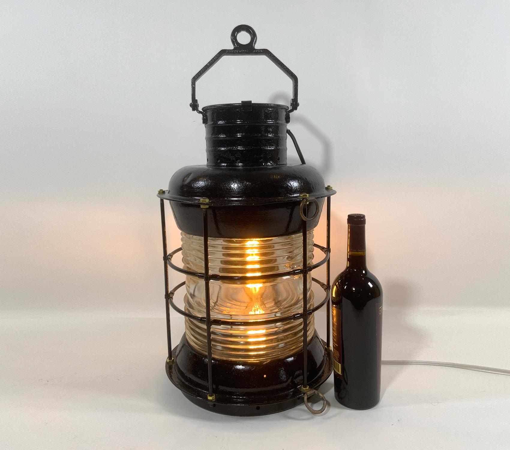 Very large ships lantern with Fresnel glass lens with outside cage. Some chips to lens from years of use. Wired with a socket.

Weight: 7 lbs.
Overall Dimensions: 20