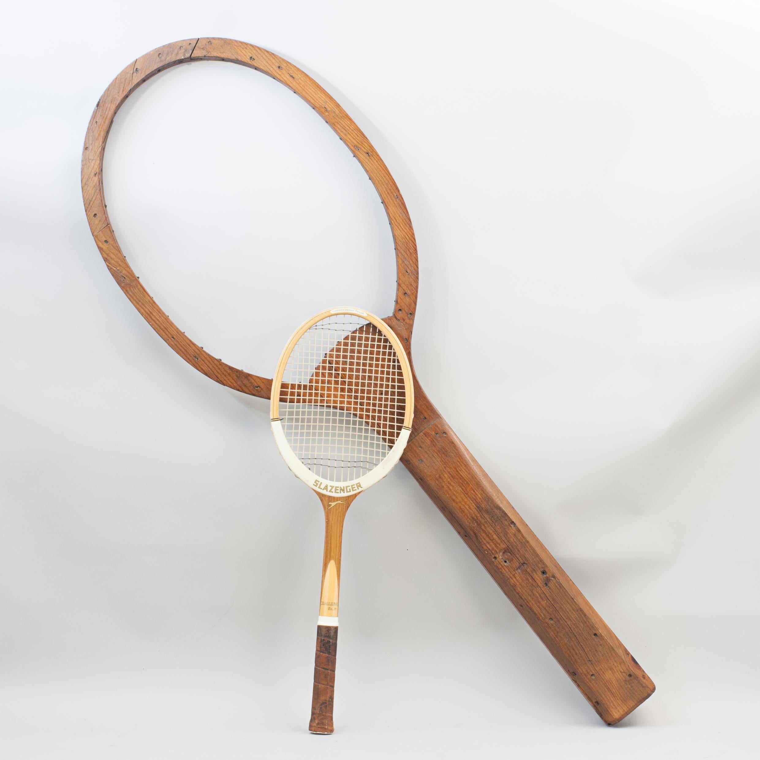 Oversized Tennis Racket.
An unusual oversized wooden lawn tennis racket, shop display or racket advertising. There are no sponsor decals on the racket. It has a good rustic charm to it, no stringing. Nice display piece.

Dimensions:
Height
134