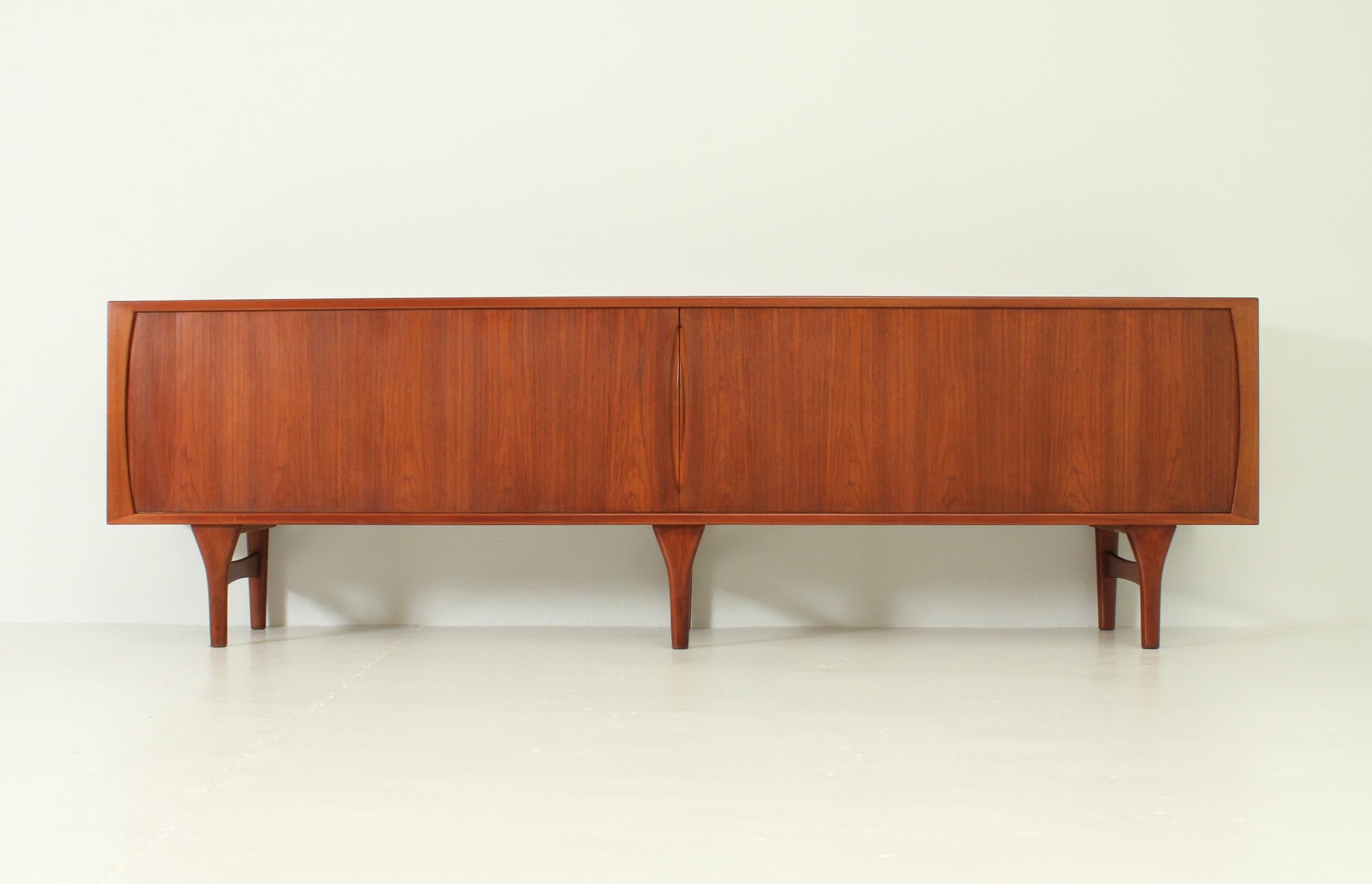 Extra large sideboard designed in 1962 by danish architect Henning Kjaernulf for Bruno Hansen. Sideboard in teak and oak wood with exceptional quality. Interior with ten drawers and two large spaces with internal shelving, sliding doors.