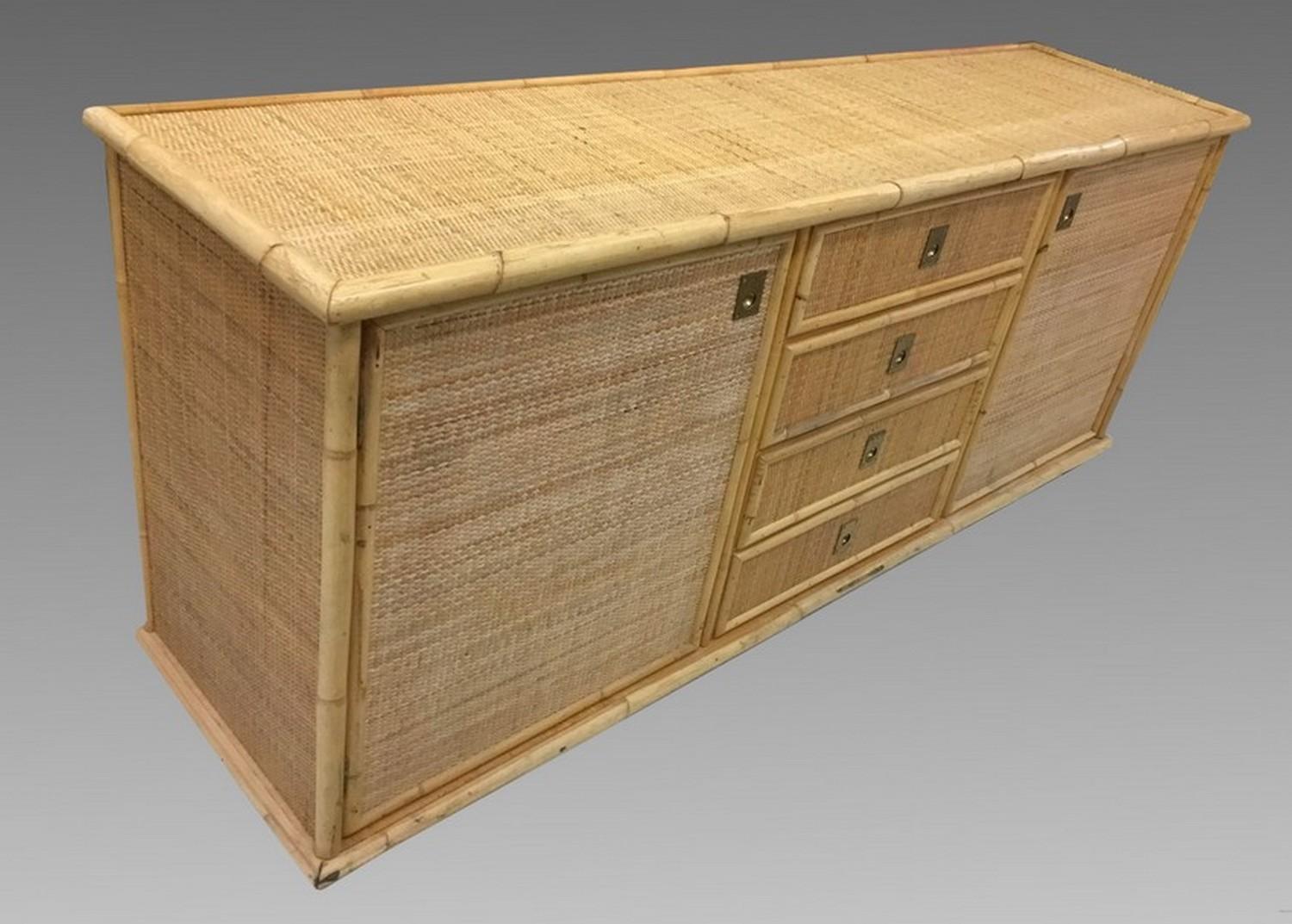Large sideboard of bamboo and caning on a wooden structure, opening with two doors and four drawers. In excellent original condition.