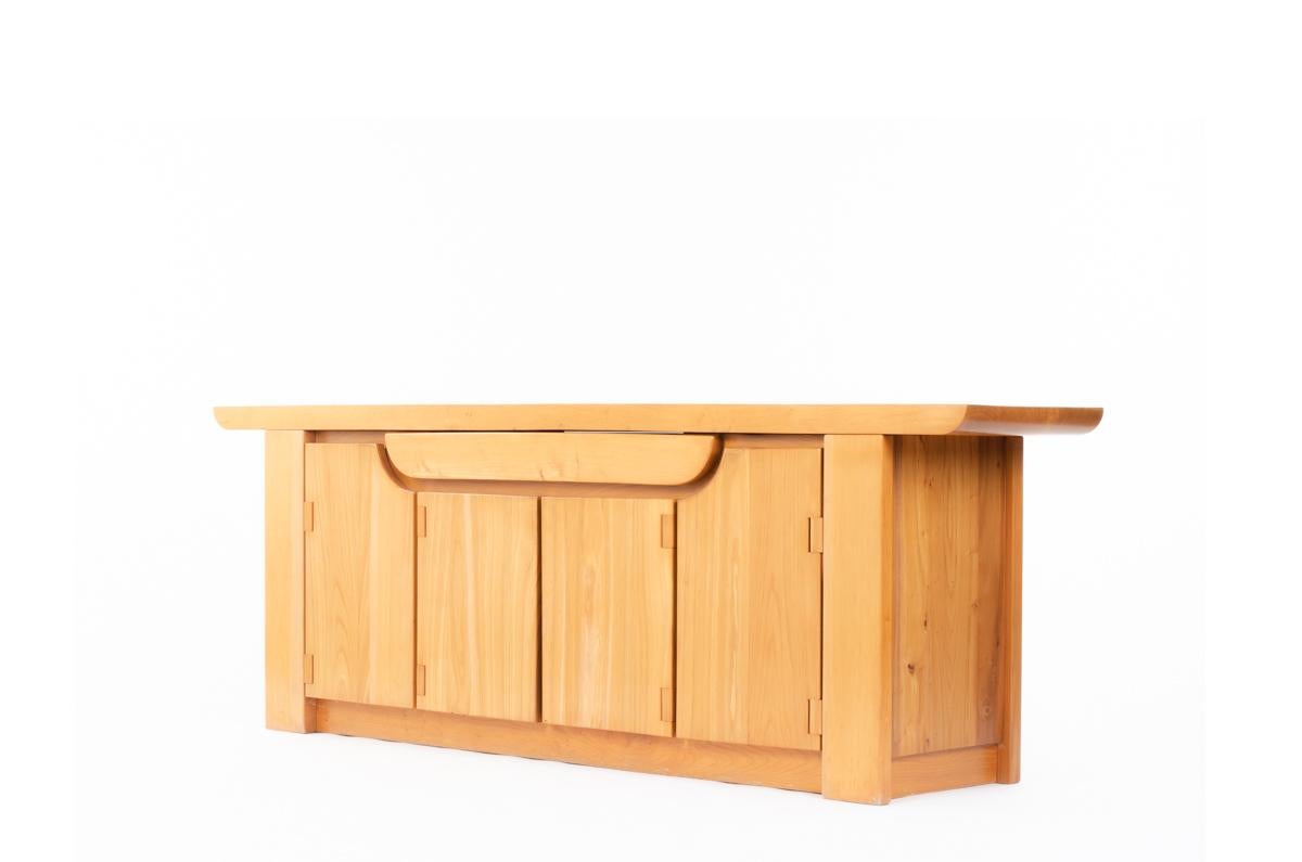 Large sideboard designed by Luigi Gorgoni and edited in 1980 by Roche Bobois. 
Entirely in elm, composed of 4 doors, a large central drawer with a nice top carved at the ends of airplane wing. 

