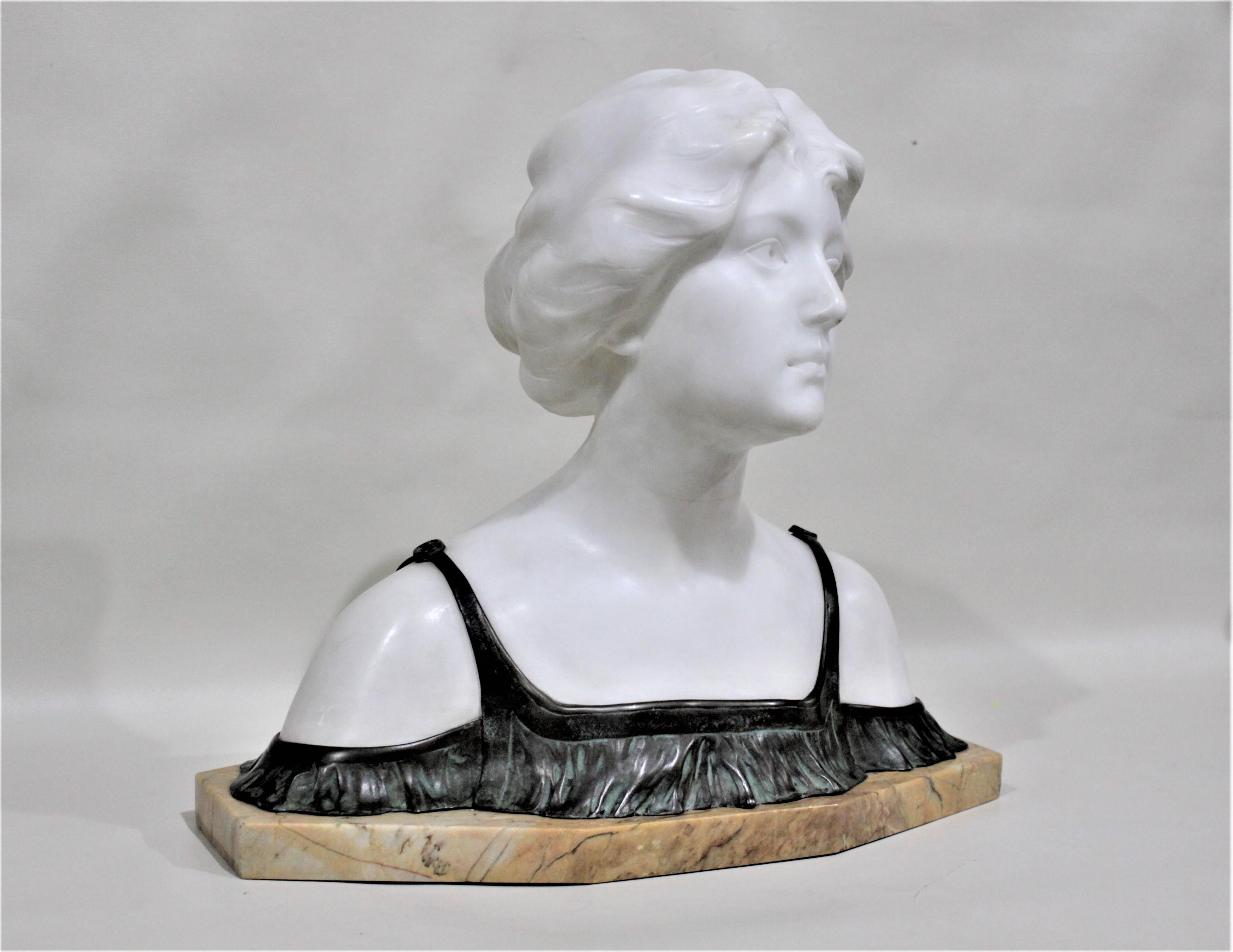 This large and substantial carved marble, or alabaster bust of a young female is signed, possibly Schurich, but since it's considerably illegible, we're not attempting an attribution and consider the artist as unknown. We presume this sculpture was