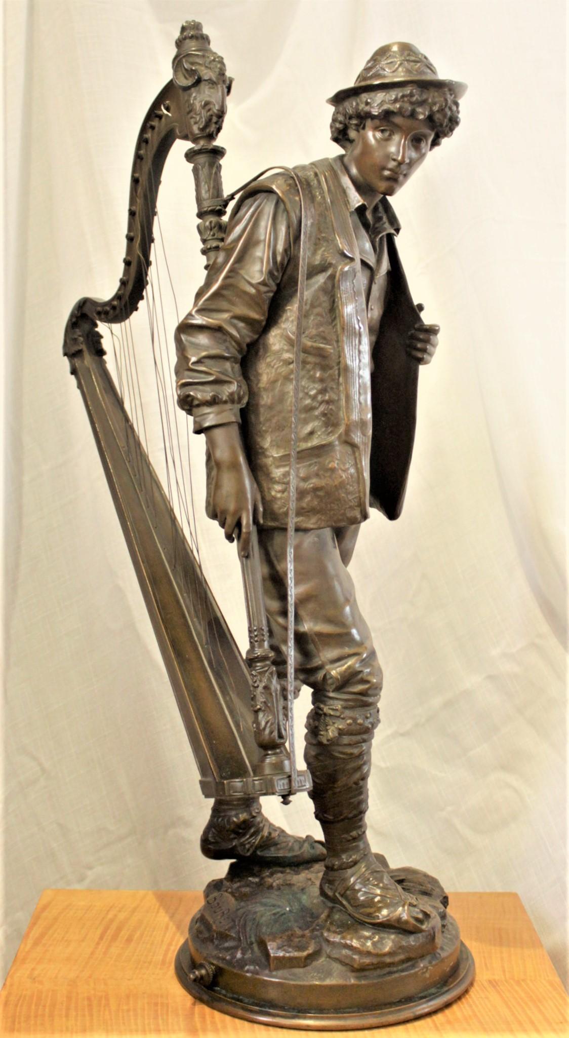 This large and detailed bronze sculpture was done by the French artist Eutrope Bouret in approximately 1880 in the period Romantic style. The sculpture depicts a young male carrying a harp. The sculpture is clearly signed 