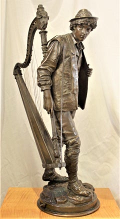 Large Signed Eutrope Bouret Bronze Sculpture of a Young Man Carrying a Harp