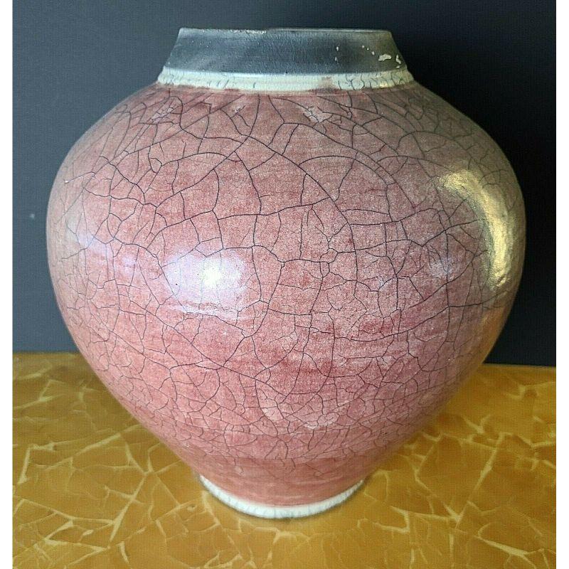 Large signed Native American style 2 tone crackle glaze hand thrown Raku pottery vase

Approximate measurements in inches
14