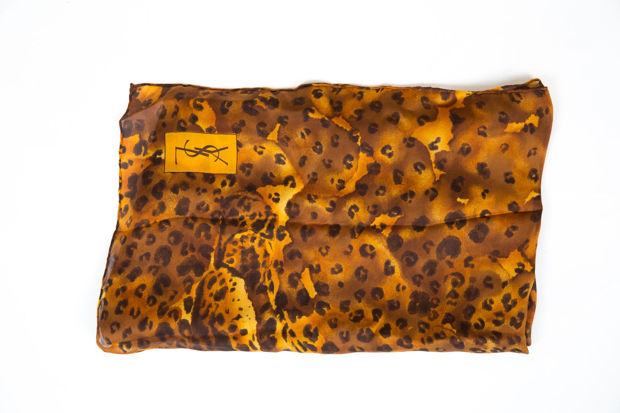 Gorgeous Saint Laurent large panther print silk shawl featuring animal heads, animal pattern, a YSL signature.
Marked YSL
69.2in (176cm) X 35,4in. (90cm)  In excellent vintage condition.  
Made in France.  
We guarantee you will receive this