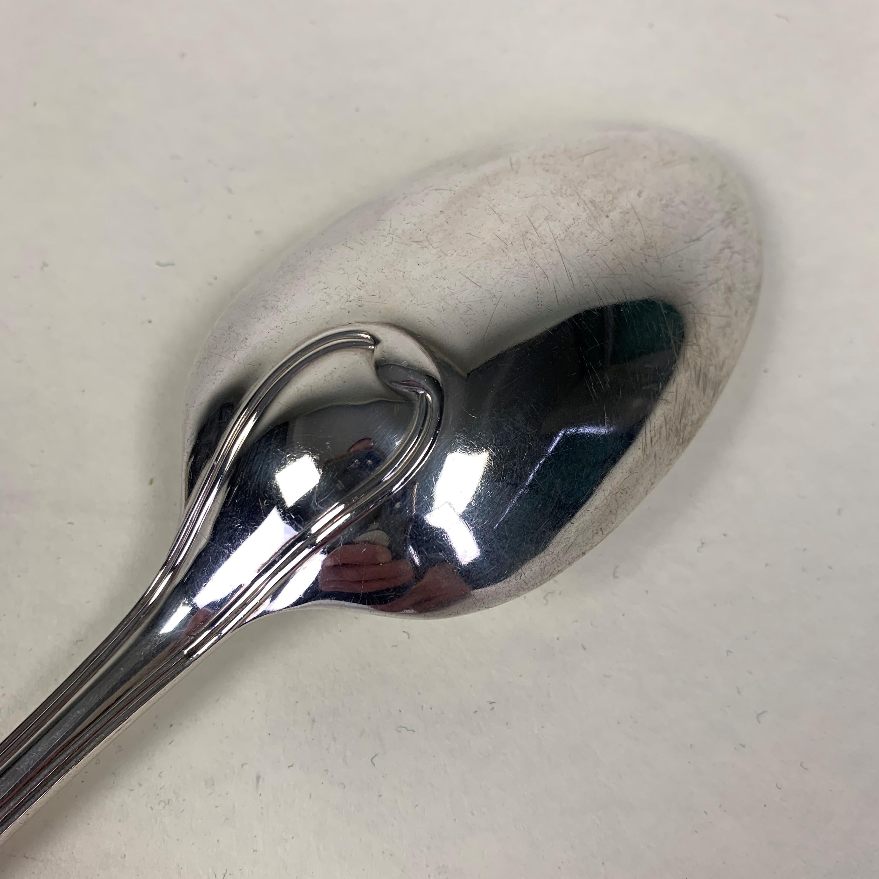 Large silver basting or serving spoon, London 1901 by Charles & Richard Comyns. In Excellent condition with almost no sign of ware or damage. Engraved with a fascinating crest of a simple raised hand with open palm.
200 grams. Size: 312mm long.