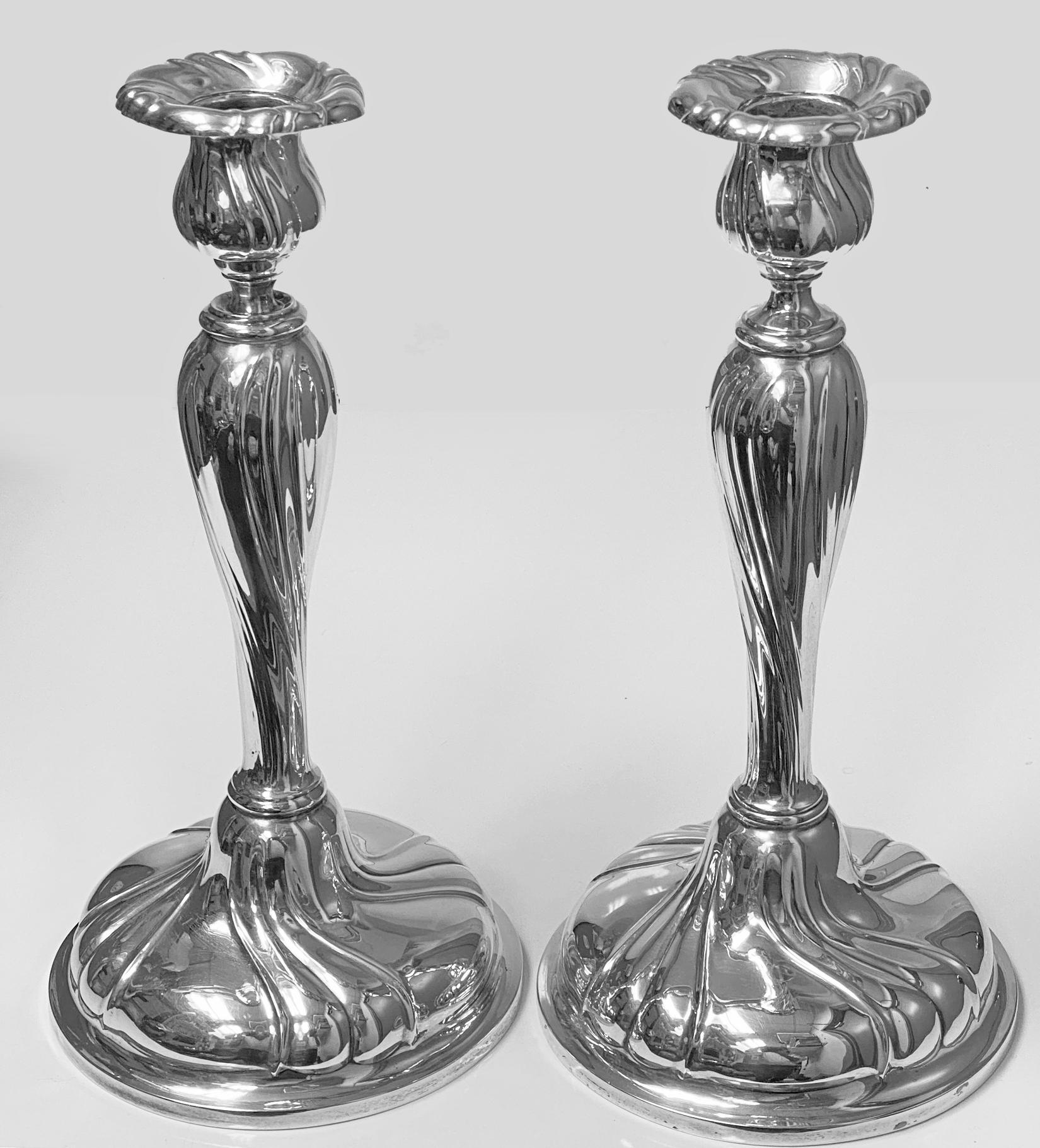 Large silver candlesticks Czechoslovakia, circa 1930. Each on circular domed swirl bases, tapered vase bellied stems supporting swirl surround sockets and nozzles conforming in design. Makers mark FB and mark for 800 std silver Czechoslovakia