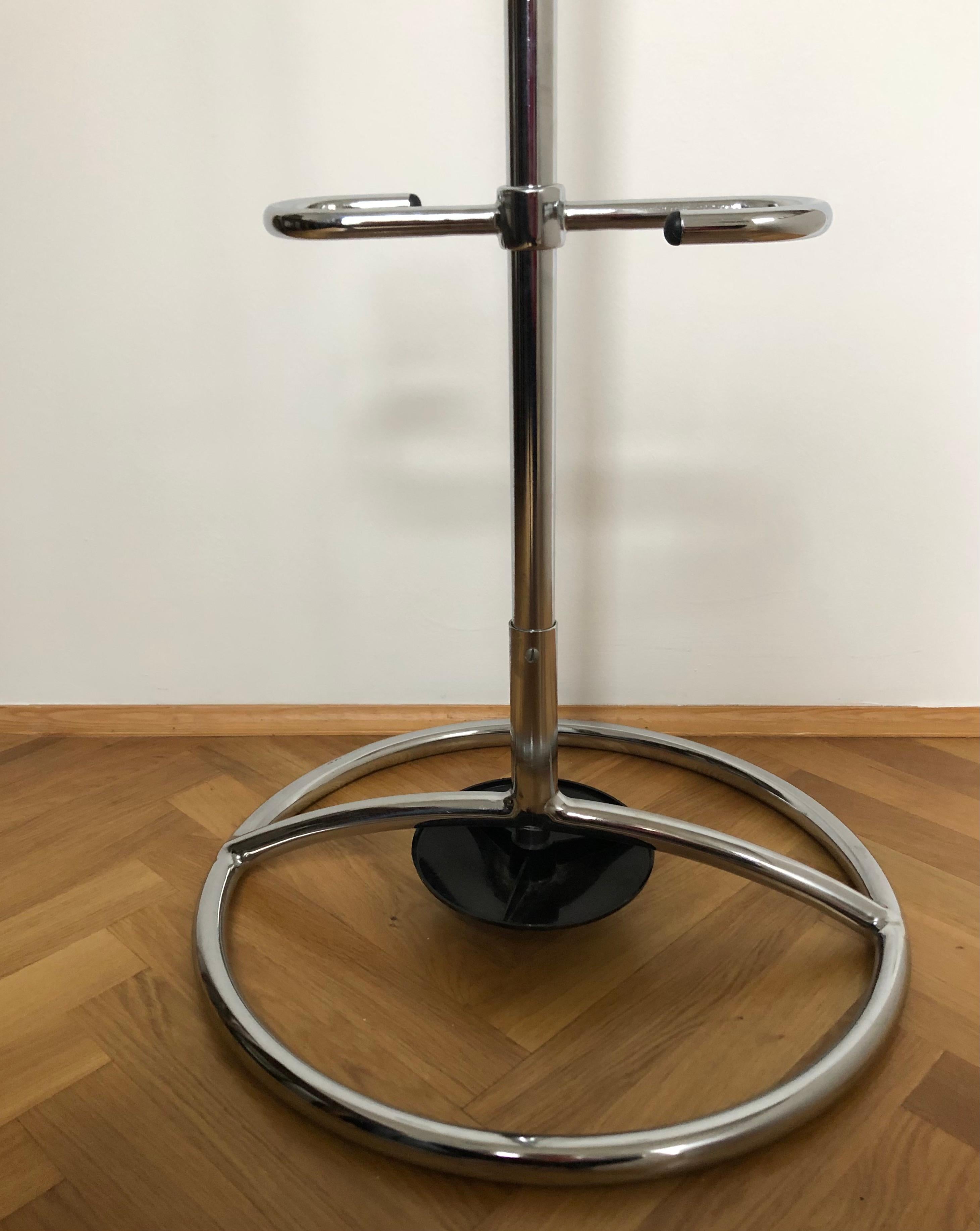 Original Gottwald coatrack.
Large solid clothes hanger with a lot of space for several coats, hats and even umbrellas.
Its made of chrome-plated Iron pipes, bakelite-balls on the endings.

One picture shows a similar piece in a 