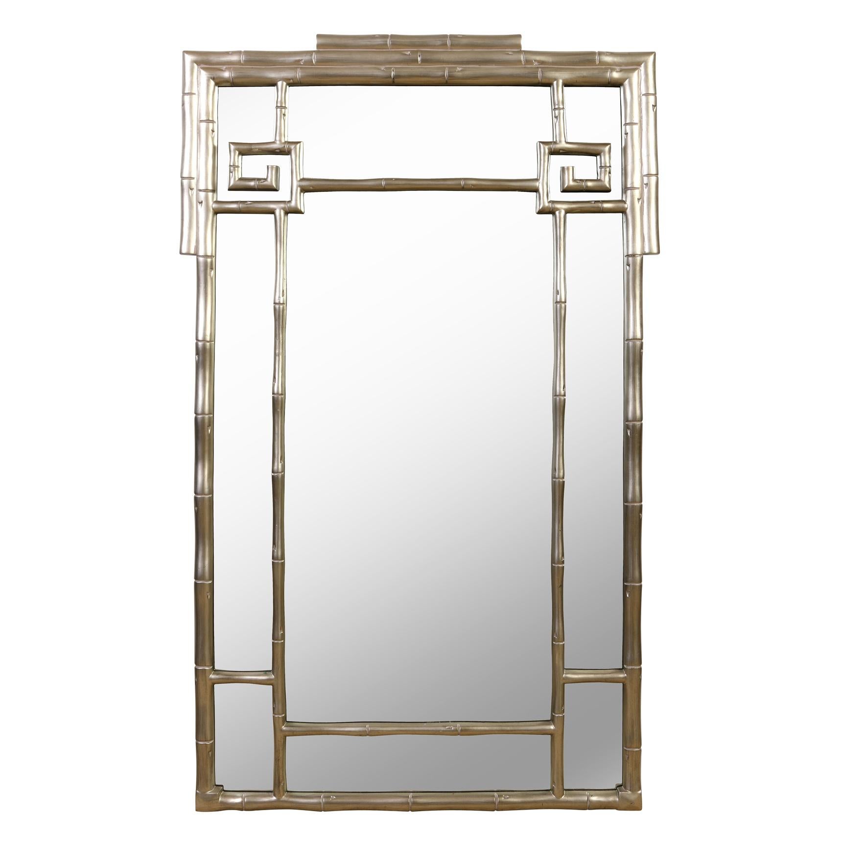 A large silver leaf mirror with bamboo motif frame.