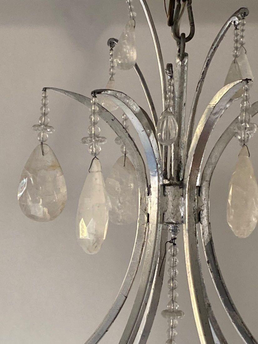 Large silver leaf wrought iron and rock crystal chandelier.
 
Made in USA 
 
*6 lights 
 
Dimensions:
 
54