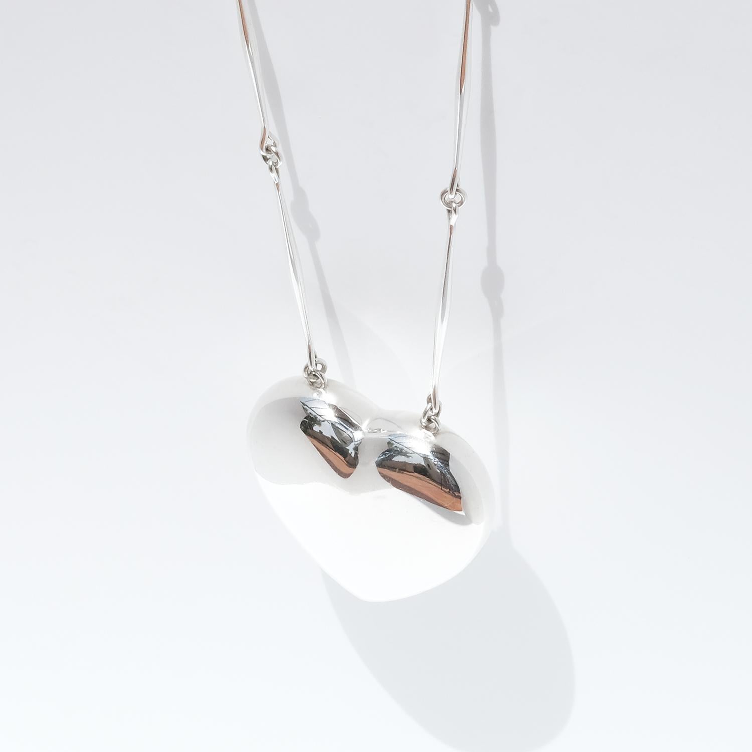 This sterling silver necklace has a distinct, very large heart pendant. It is a bold but at the same time elegant piece that is called Joy. It is not hard to see that Astrid Fog designed it in the 1970s.

This is a statement necklace which would