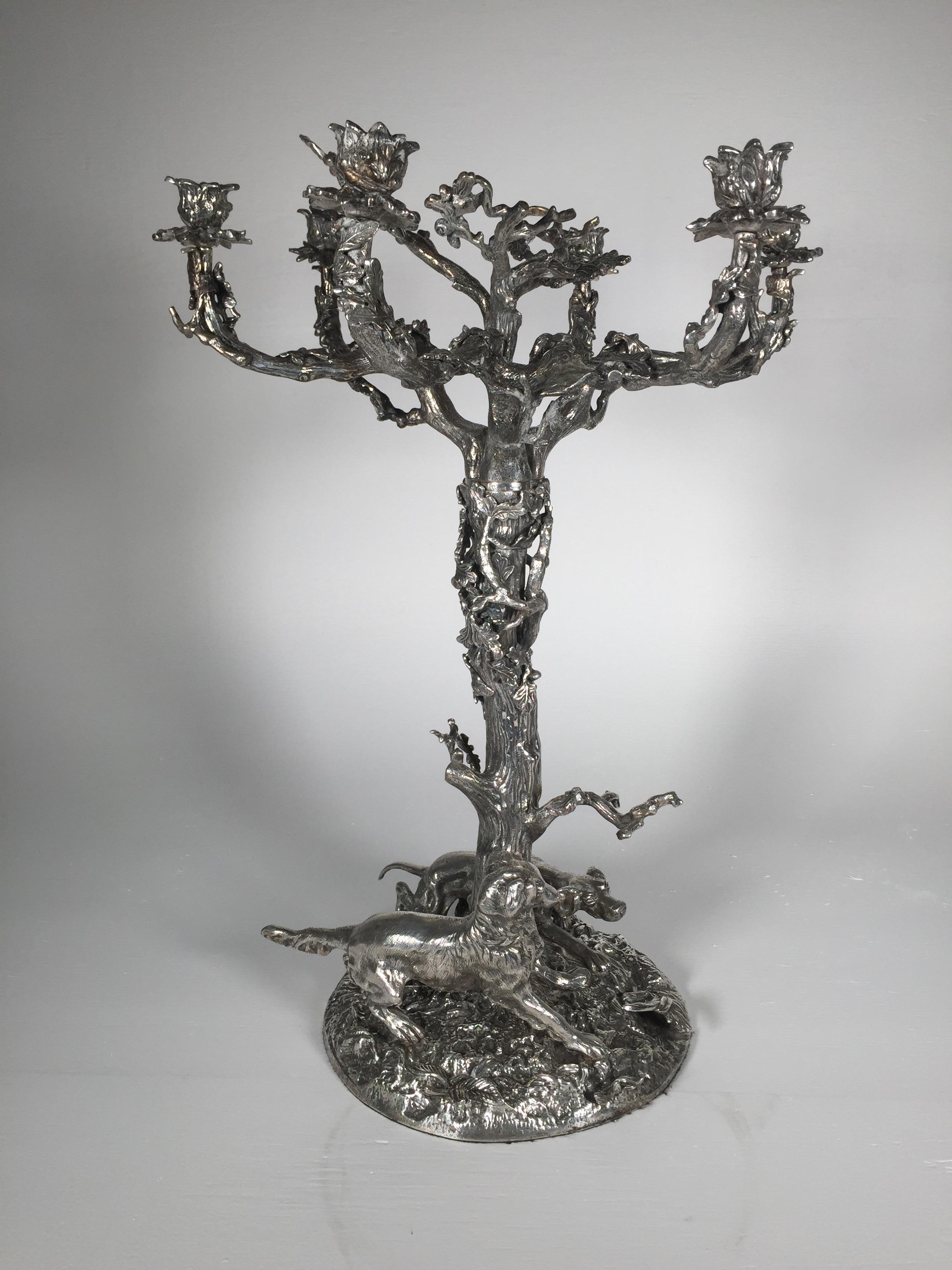 Impressive and large silvered bronze six-light candelabra with sporting dogs. The arms and centre portion are in a branch and leaf form with a pair of sporting dogs on the base. Marked Valenti on body.
