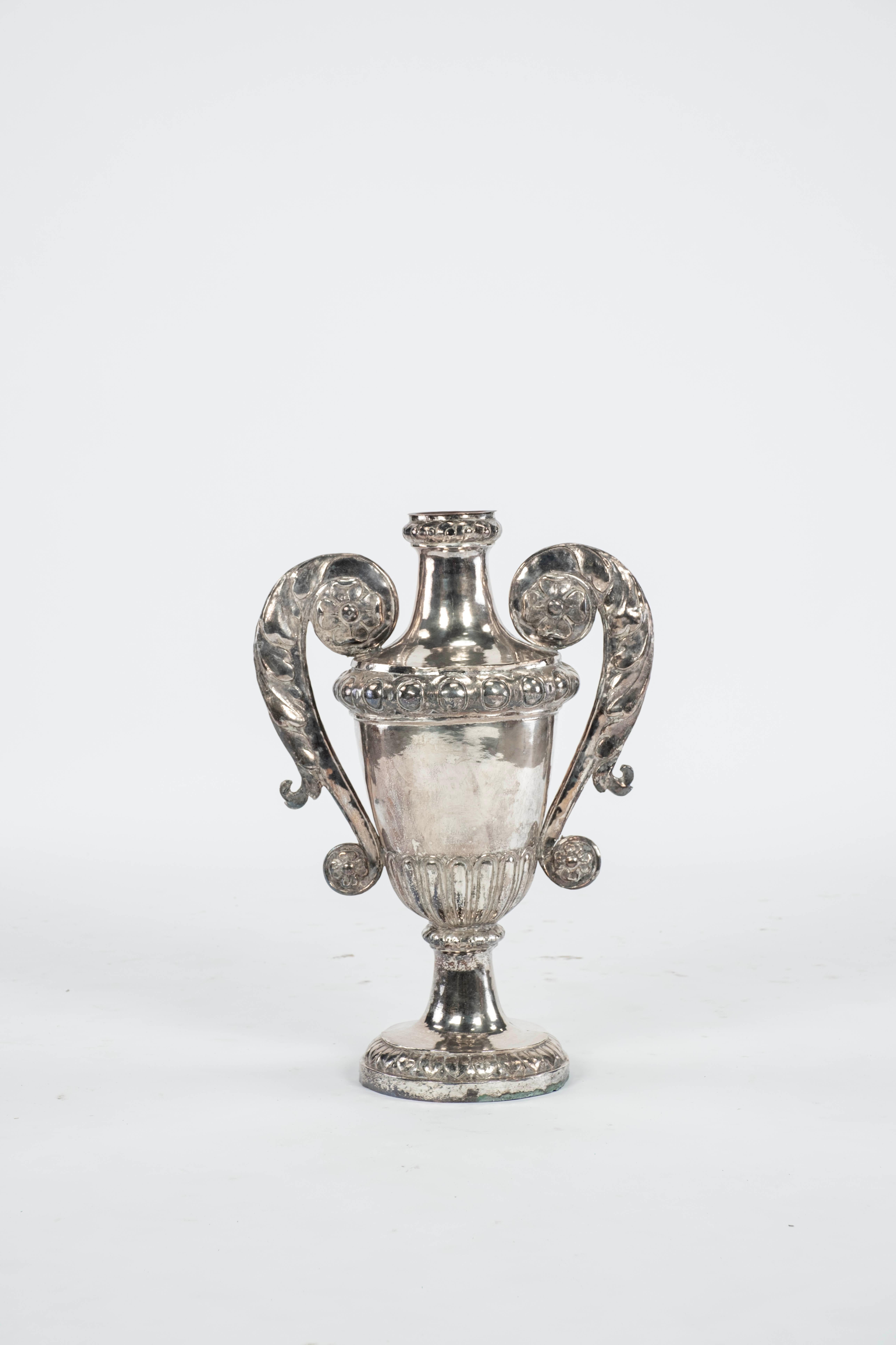 Great proportions of this hand hammered silver metal urn.  