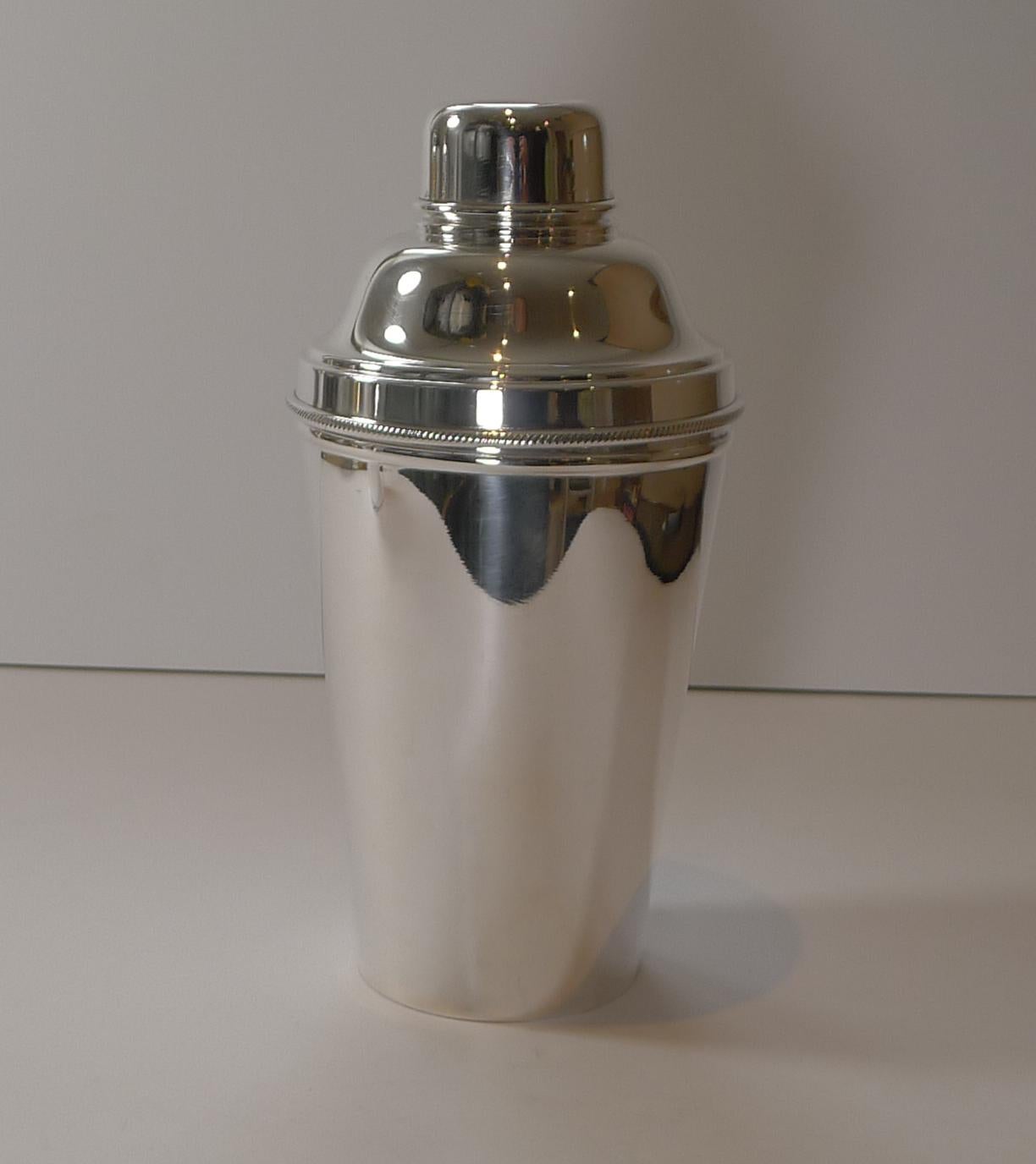 A wonderful large Art Deco silver plated cocktail shaker signed by the well renowned silversmith, James Dixon and Sons, the underside marked EP for Electro-Plated Nickel Silver and also marked Made In England. It is the most desirable example of