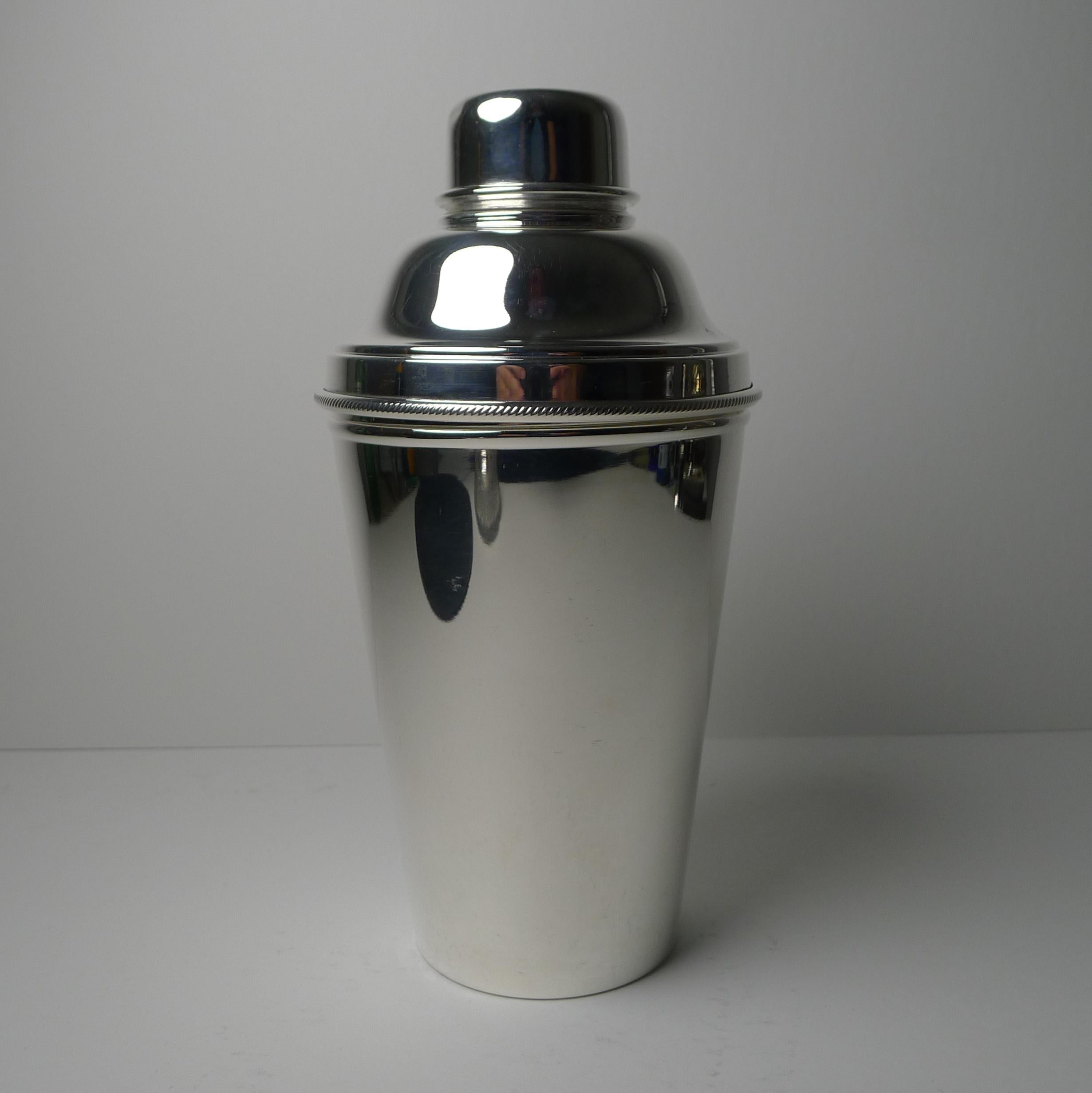 A wonderful large Art Deco silver plated cocktail shaker signed by the well renowned silversmith, James Dixon and Sons, the underside marked EP for Electro-Plated Nickel Silver and also marked Made In England. It is the most desirable example of