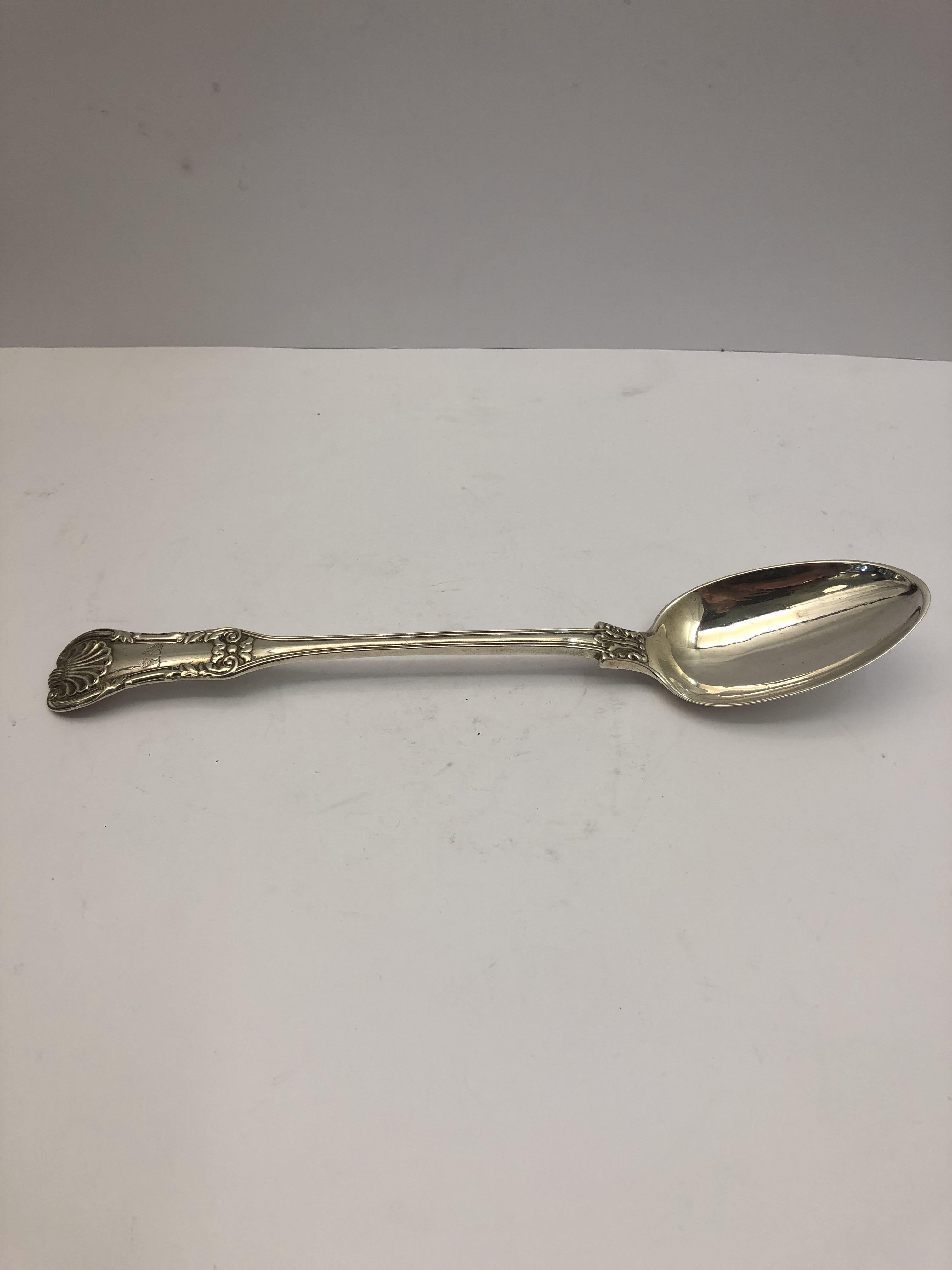 Large silver serving spoon, English, 1824.