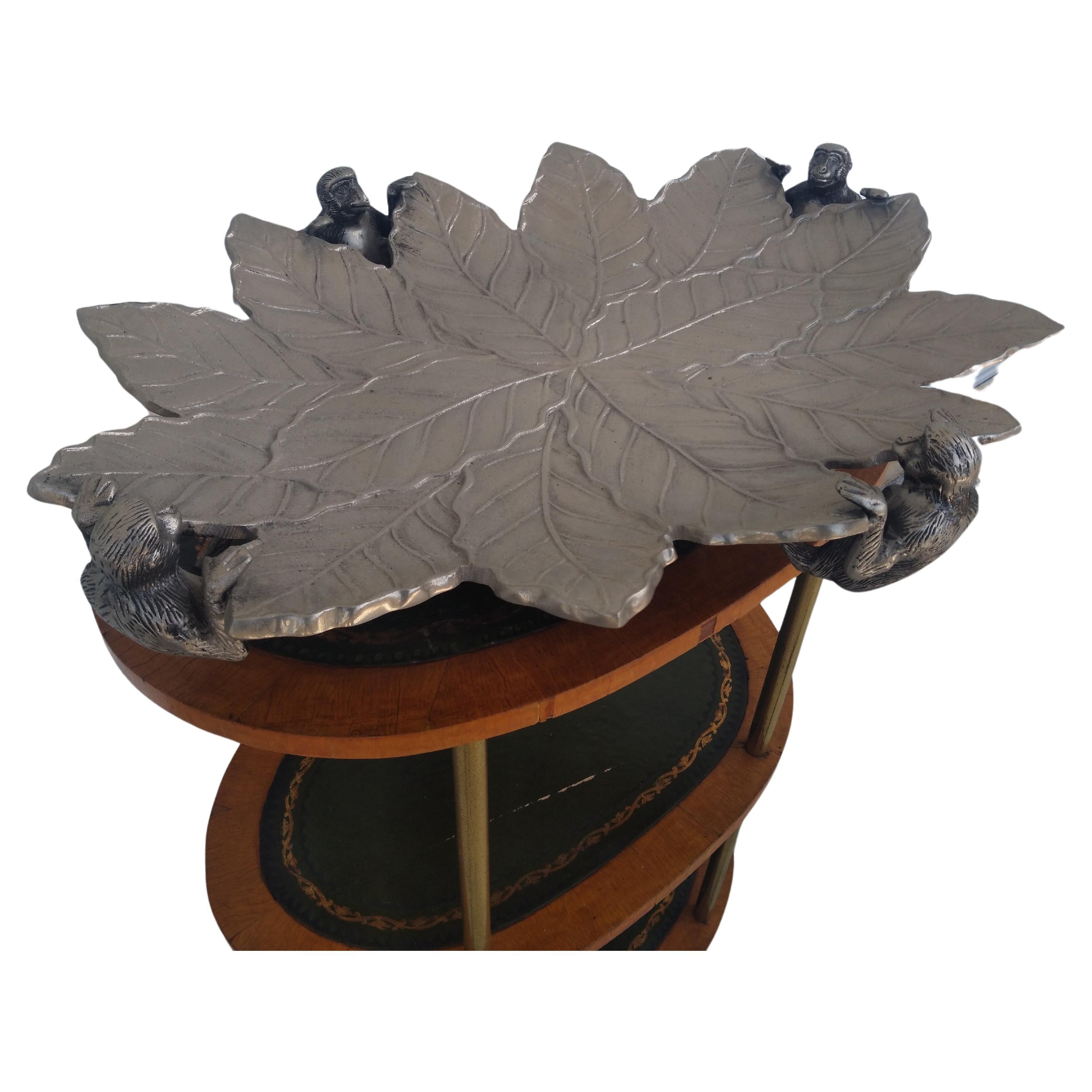 This is one of a pair of this large serving tray. It's made of metal and has sculpted monkeys hoisting the tray as it's feet. It sits up off the table and is quite magnificent to behold. 

They come crime Galleries Z.
2 available.