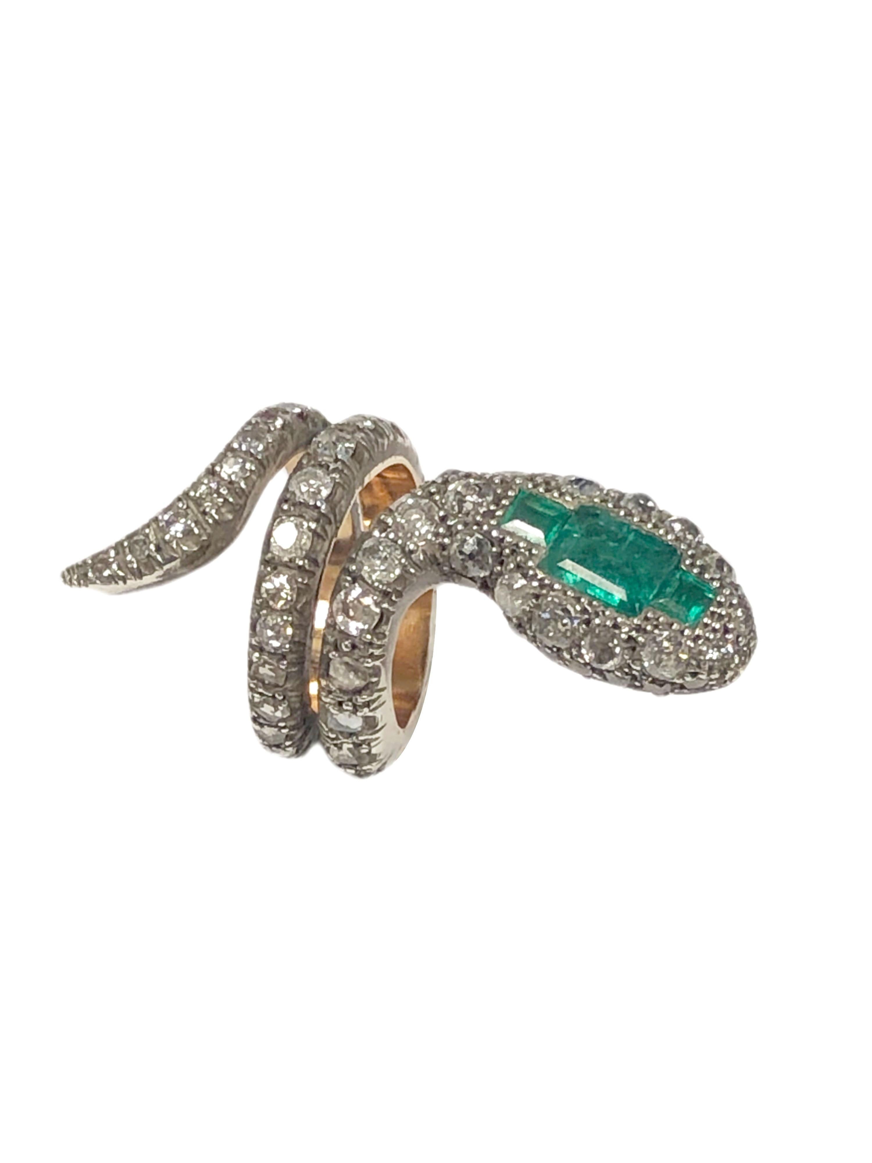 Silver Topped and Yellow Gold Snake Ring, measuring 1 3/4 inches in length from tip of the tail to the head. Set with # fine Color Step cut Emeralds totaling approximately 1.75 Carats and further set with old Mine, Rose and Single cut diamonds