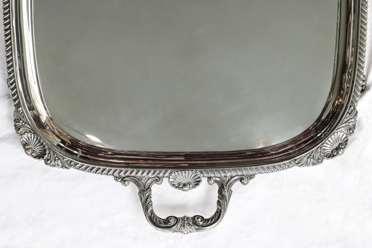 Very large and heavy silver plated tray by Hawksworth Eyre & Co. Ltd, London, mid to end 19th Century.

This tray has a rectangular shape and a grooved edge with acanthus leaves decorations. With shell shaped corners and shaped handles. Its
