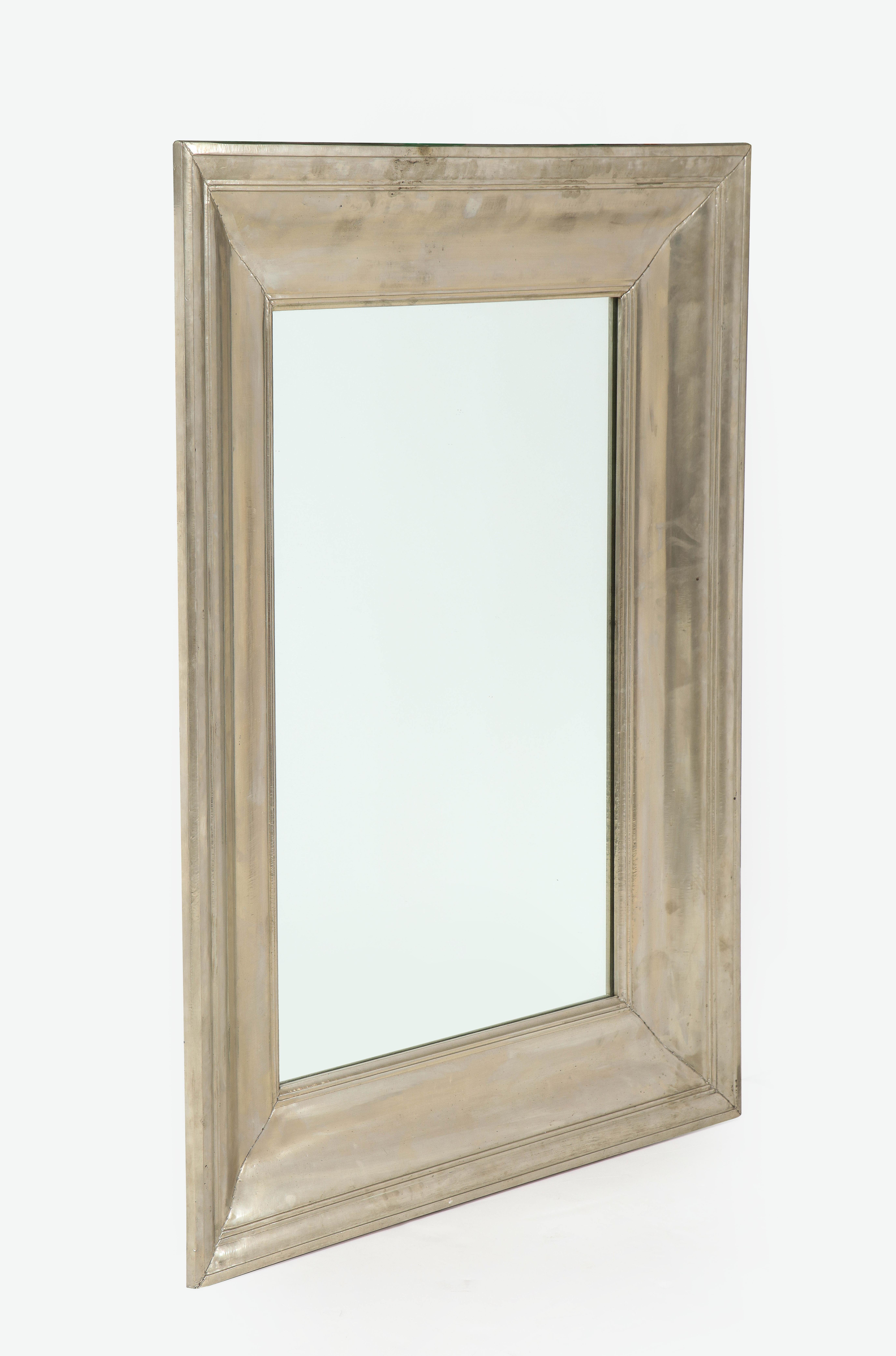 Wonderful large bold framed mirror.
The metal frame has a silvered finish and can be hung horizontally or vertically.