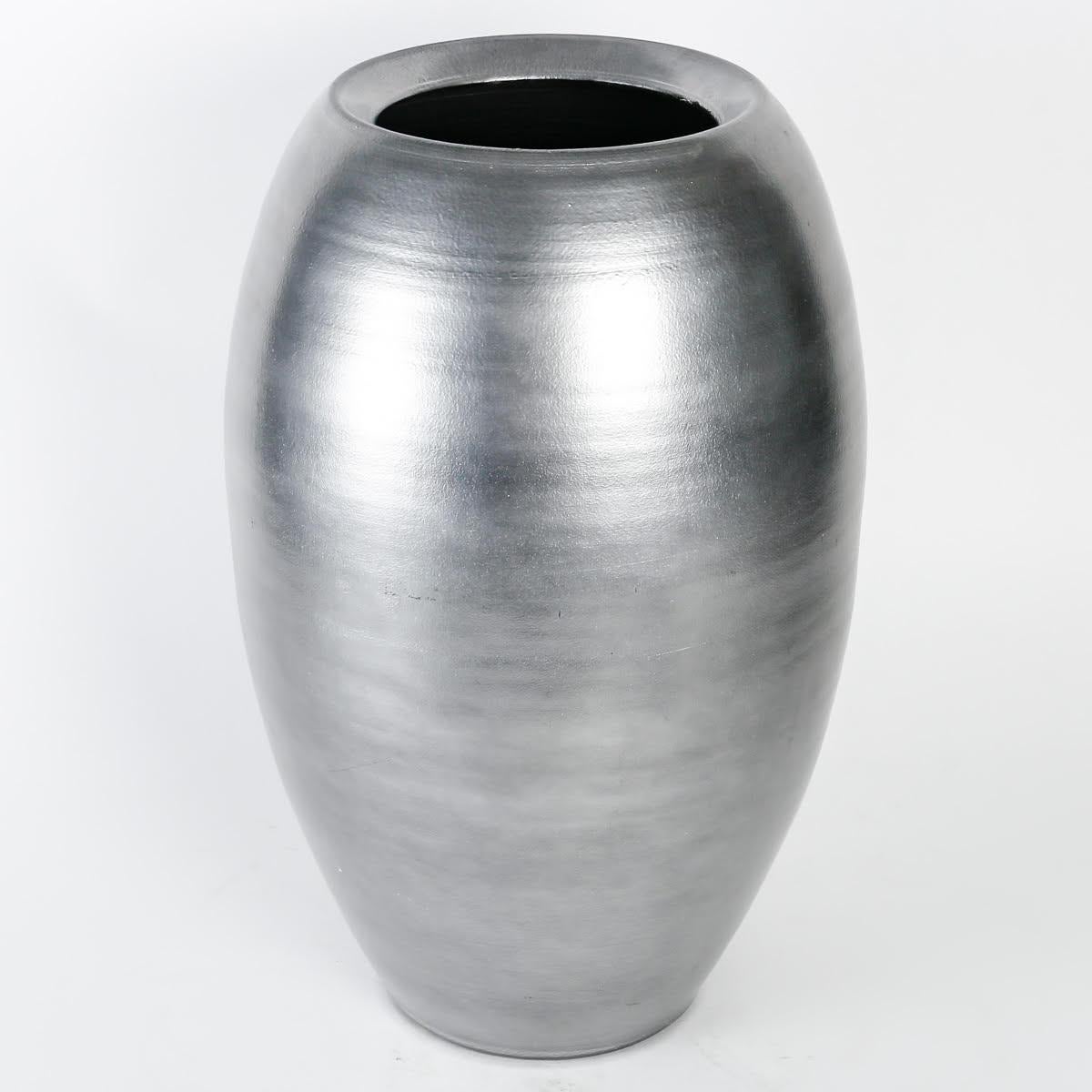 Large Silvered Terracotta Vase

Twentieth century silver-plated terracotta vase.

Dimensions: h: 46cm, d: 27cm