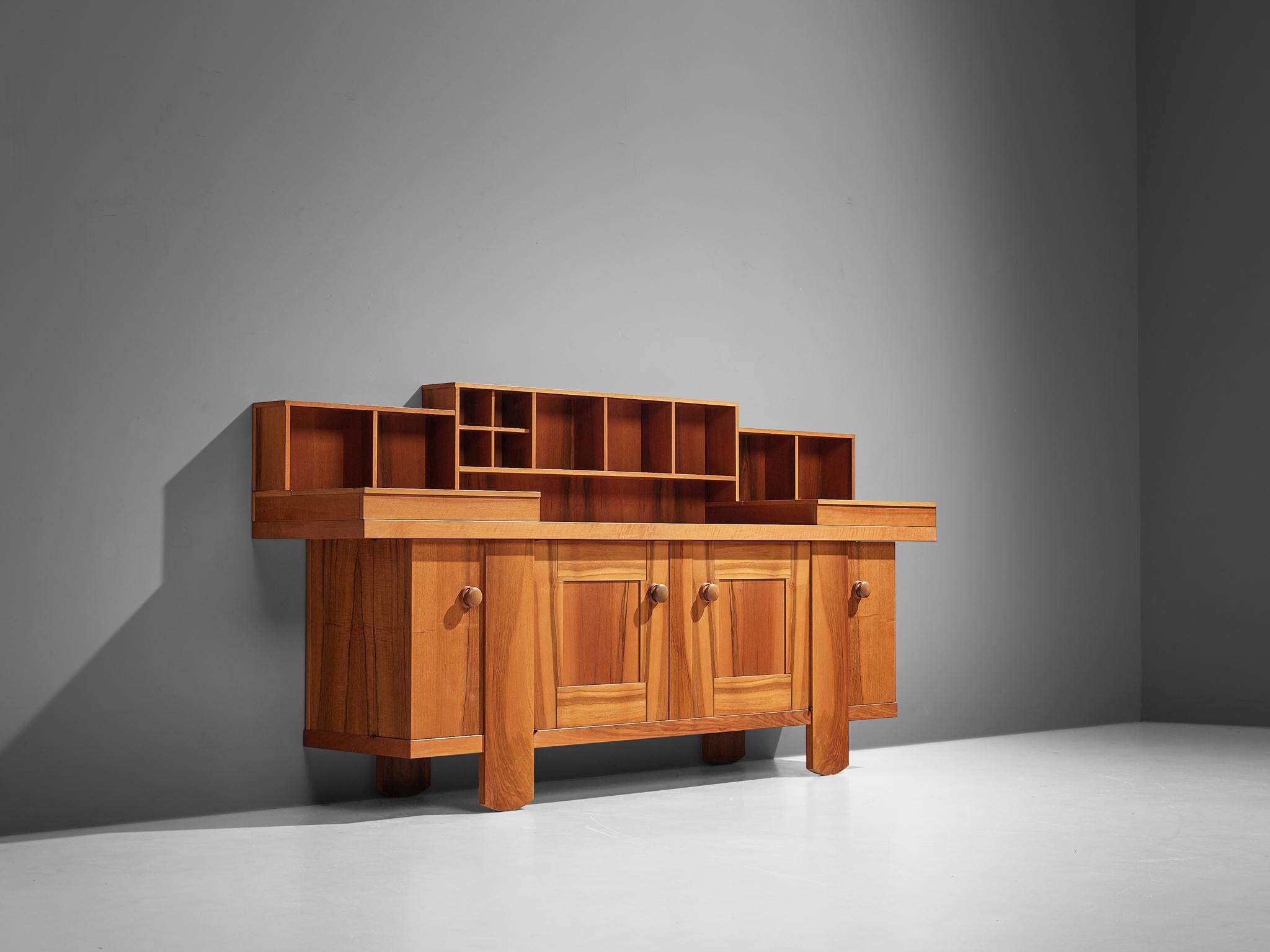 Silvio Coppola for Bernini, sideboard, walnut, Italy, 1966

This impressive sideboard or credenza was designed by Silvio Coppola. It is well-structured with different compartments to store your belongings. Two doors in the middle and two corner
