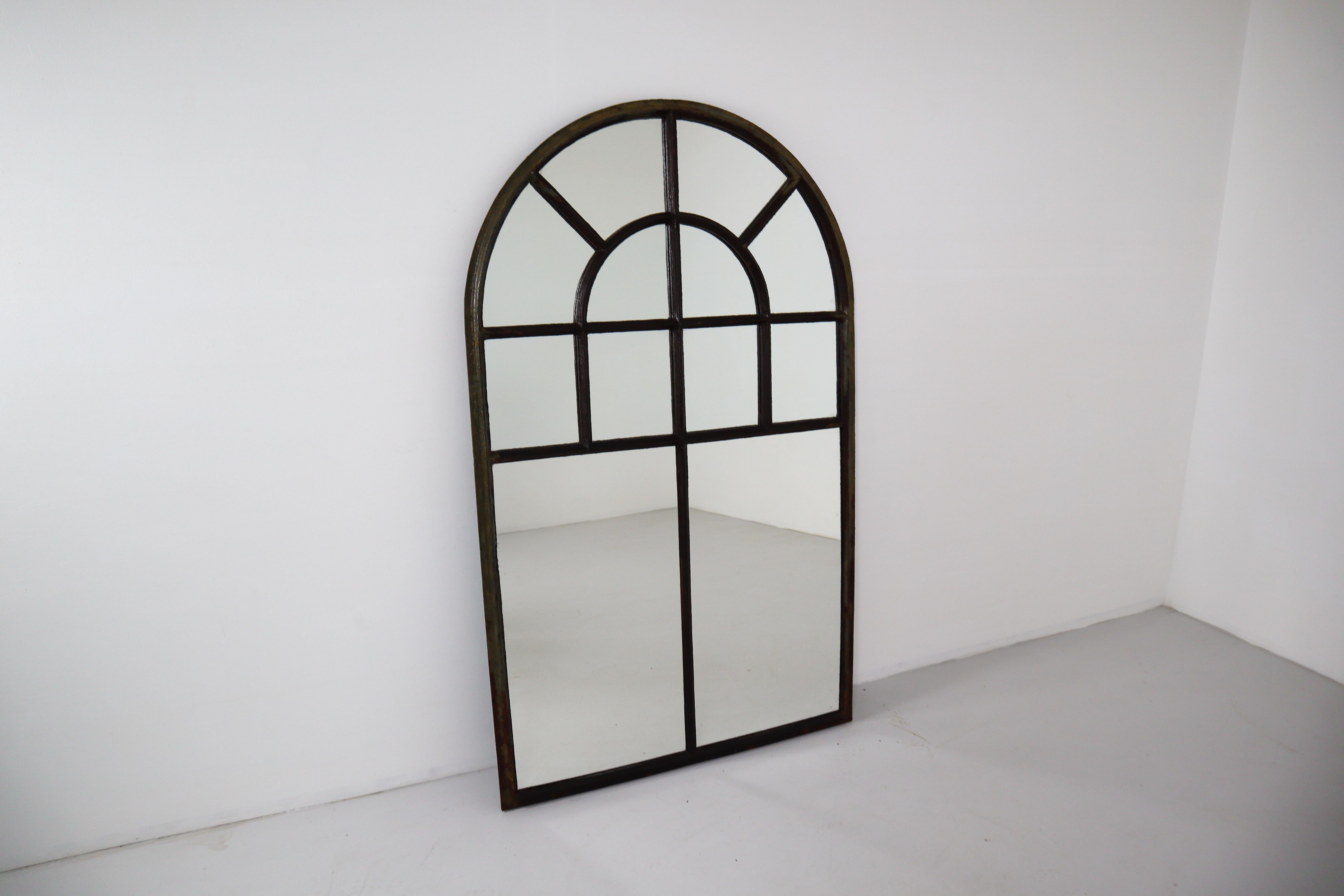 Large simple French cast iron arched Industrial window frame has been transformed into a mirror that looks stunning above a console table, hanging in a bedroom or hallway, or in any space where an understated piece that brings light and reflection