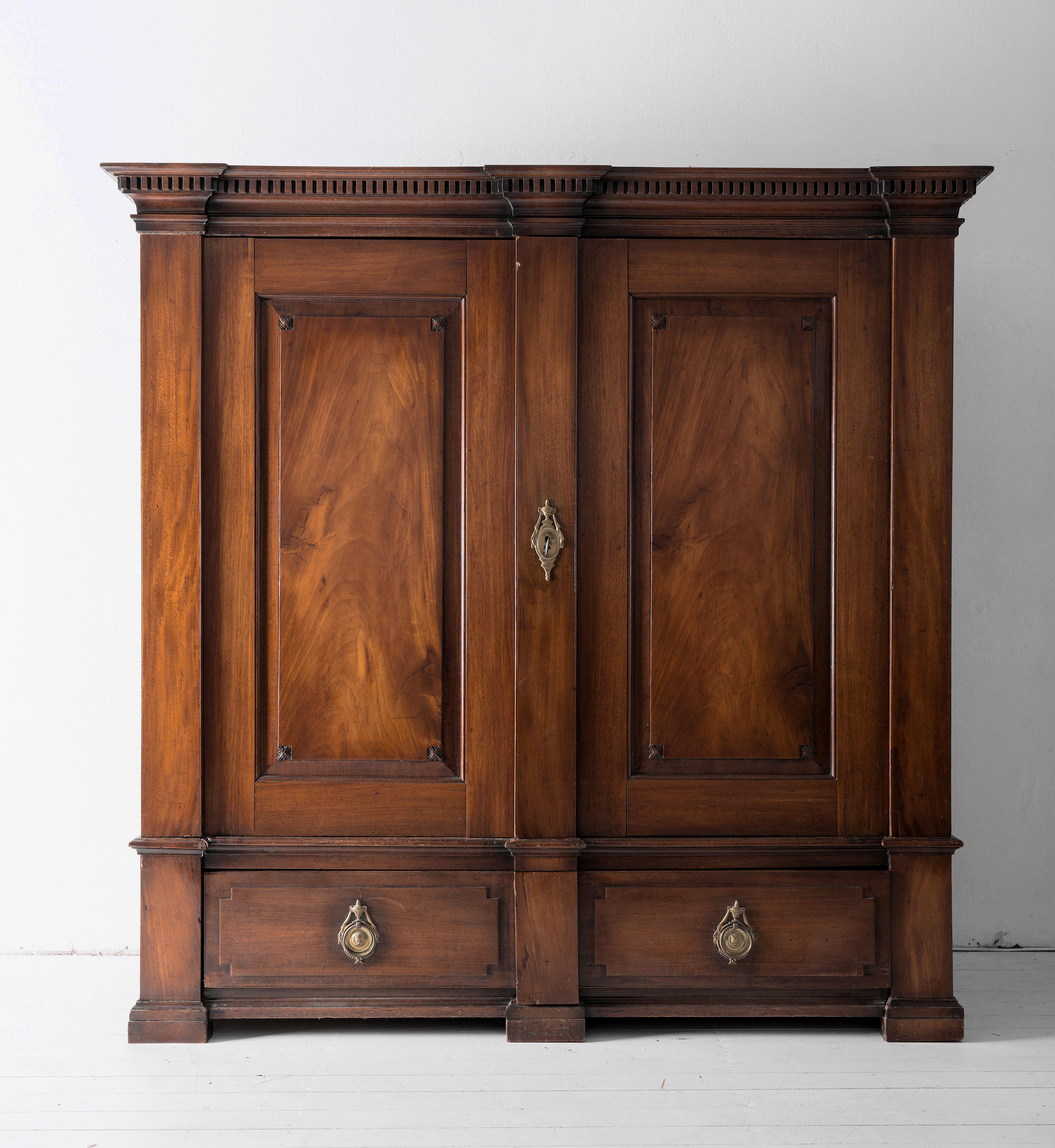 A very impressive and simple late 18th century linen cupboard or armoire of pleasing proportions and a good, authentic finish to the Mahogany, not too shiny or to distressed, retaining its original giltbronze mounts. This would work equally well as