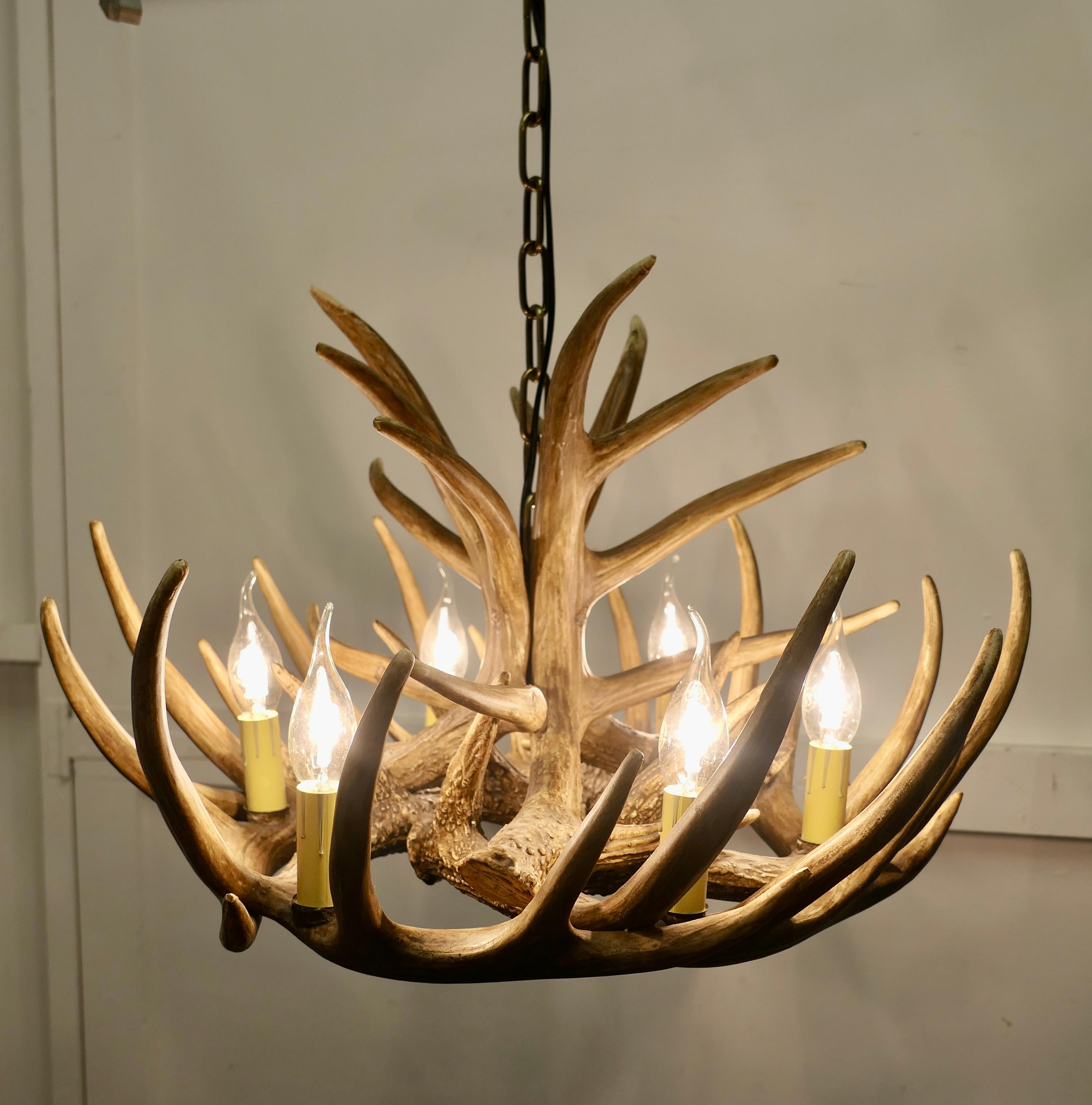 Mid-20th Century Large Simulated Black Forrest Stag Antler Hanging Chandelier    For Sale