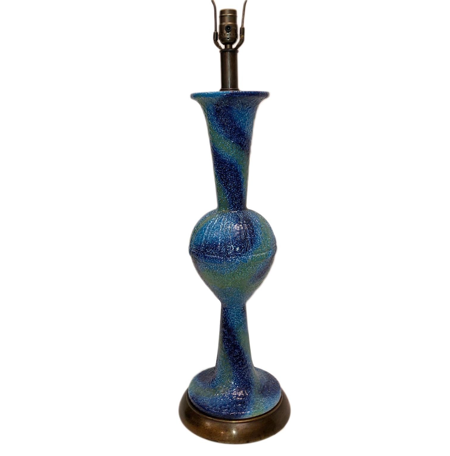 A single Italian circa 1960s porcelain table lamp with blue tones.

Measurements:
Height of body 24