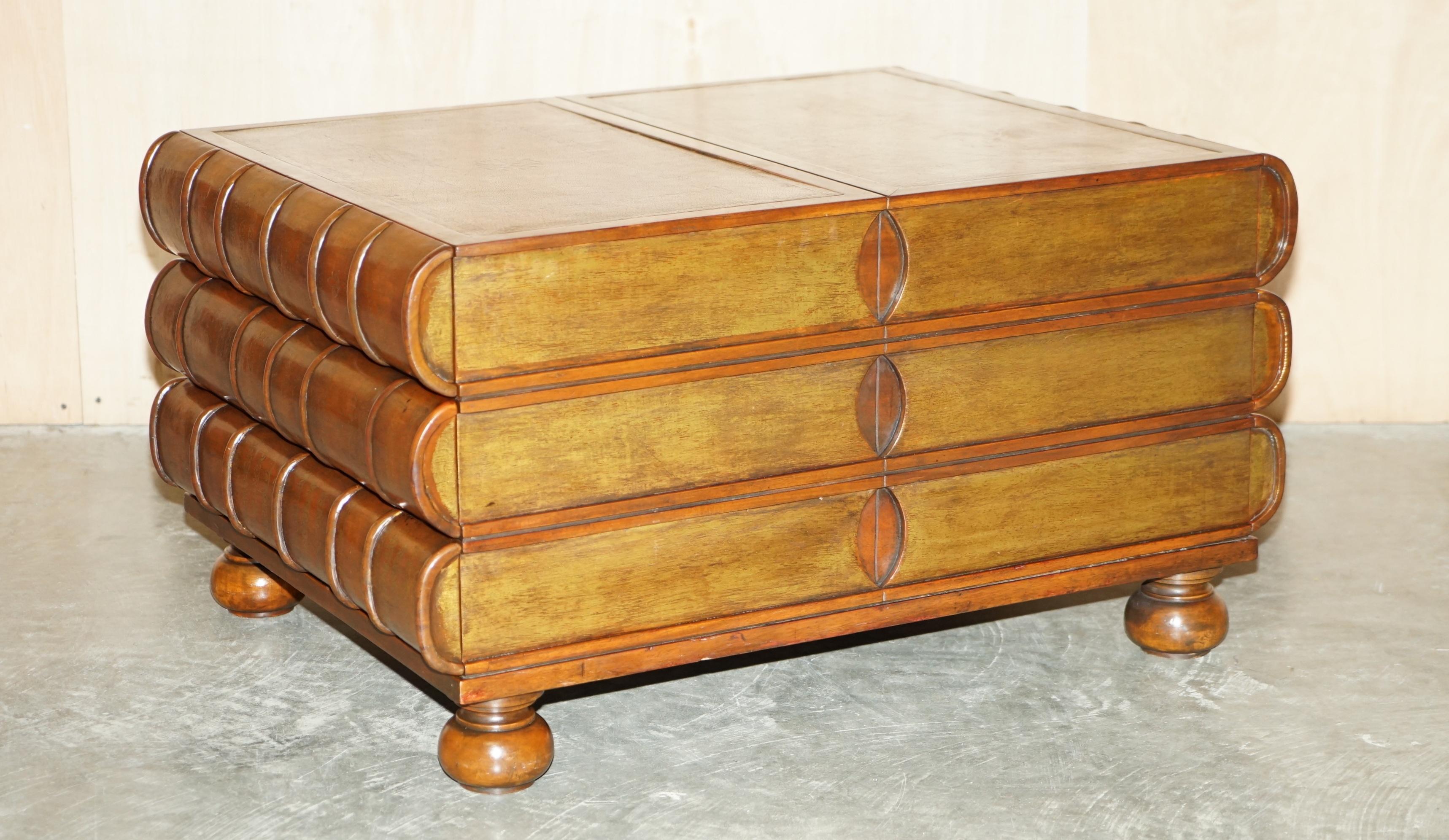 We are delighted to offer for sale this lovely Theodore Alexander stack of Scholars books coffee table with six large drawers

A well-made and decorative piece, the table has six drawers, the top is brown leather with ornate embossing, its
